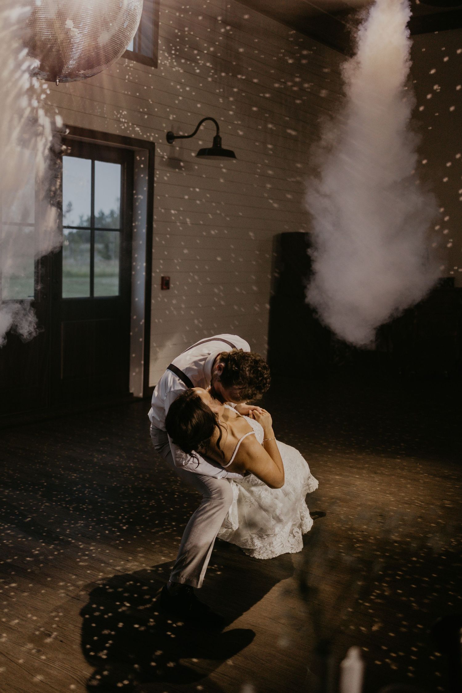 A dramatic dip during a wedding dance with smoke and sparkle effects in the background.