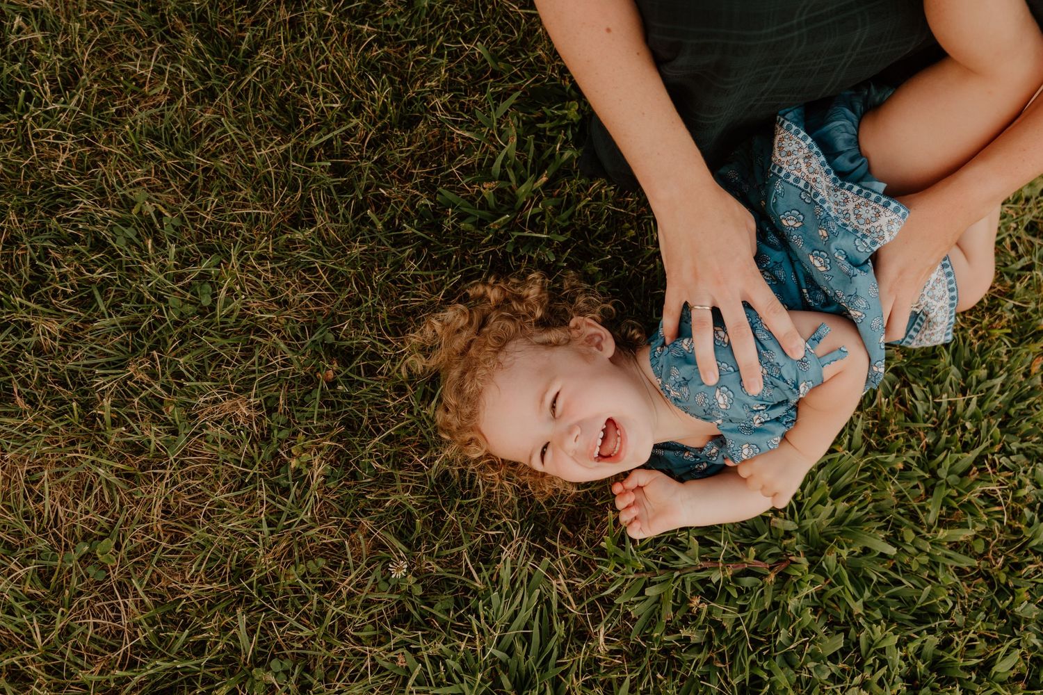 A series of candid outdoor photographs showing joyful moments on grass during a sunny summer day.