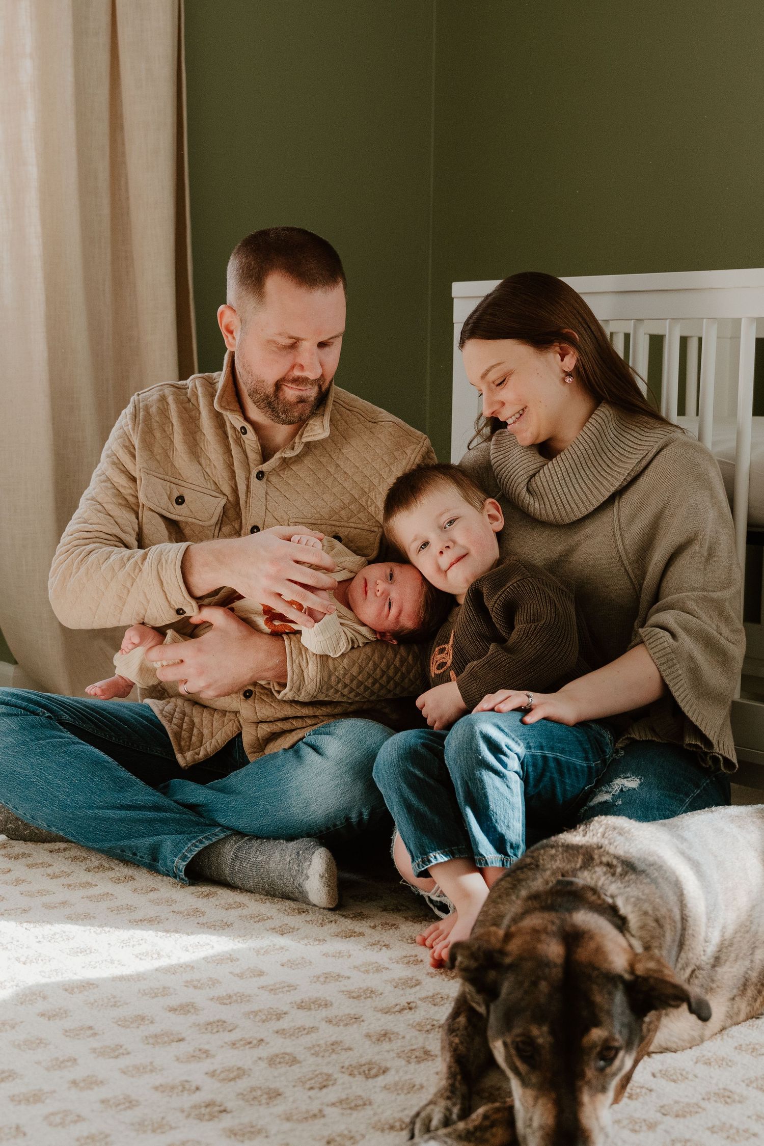 A family lounges together on a bed with their dog in a series of cozy lifestyle photos.