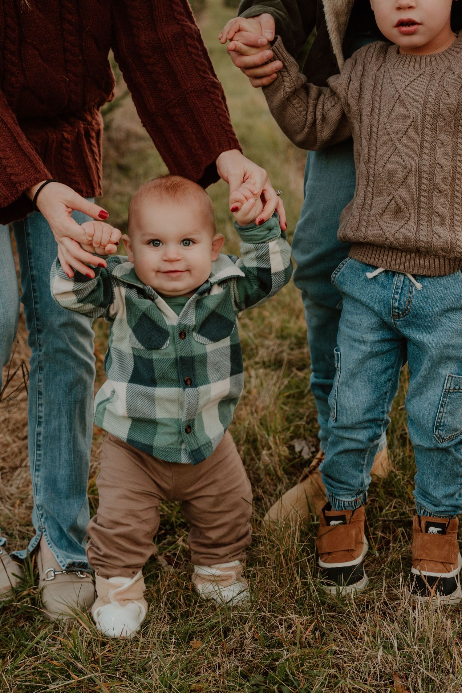 A sequence of casual family photos showing legs and feet while standing together in an outdoor setting.