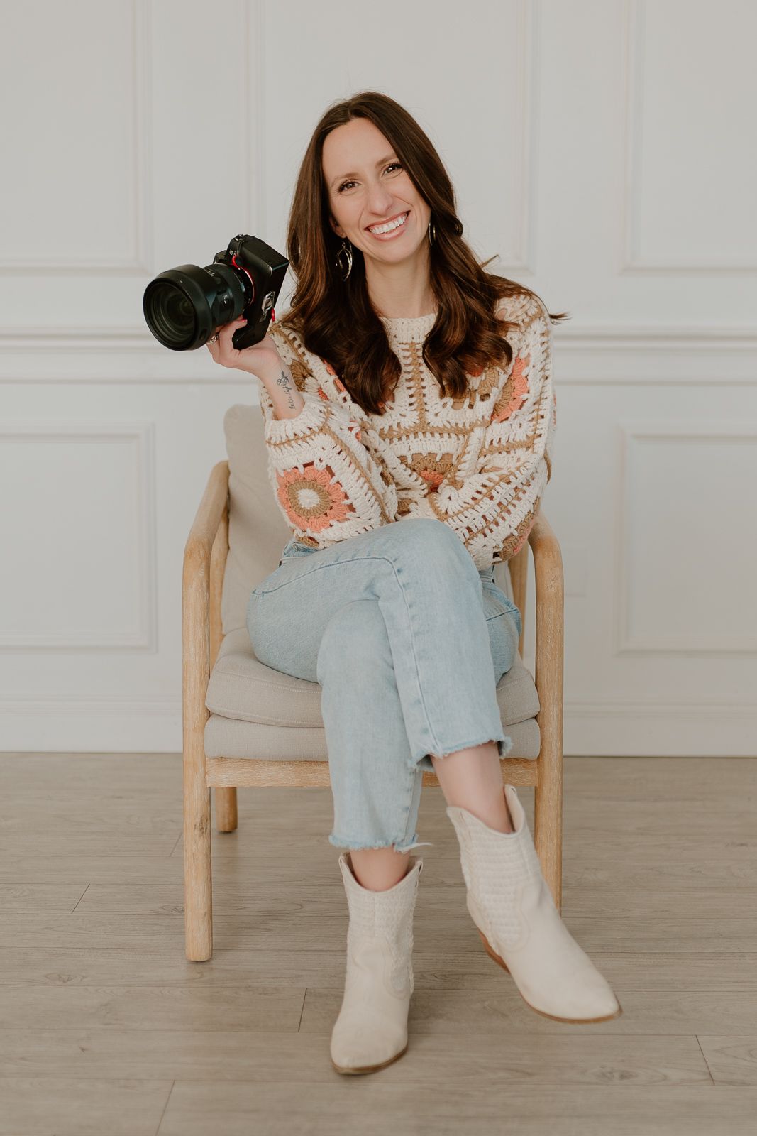 A series of lifestyle photos showing someone seated in casual wear with light denim and a cream crochet top against a white wall.