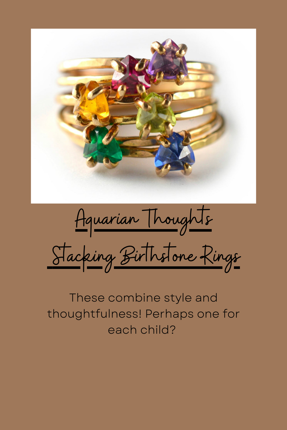 Colorful stackable birthstone rings in rainbow order displayed on gold bands.