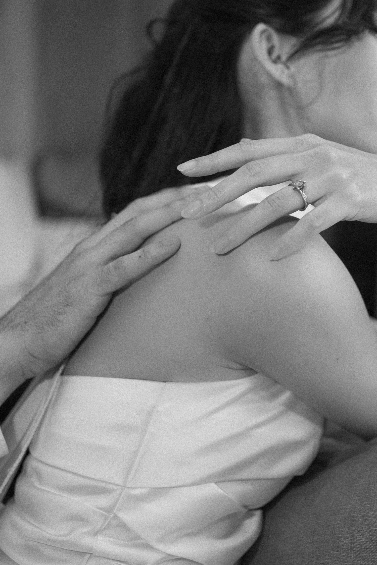 Naturally classic black and white wedding morning preparation photos showcasing genuine, heartfelt interactions.