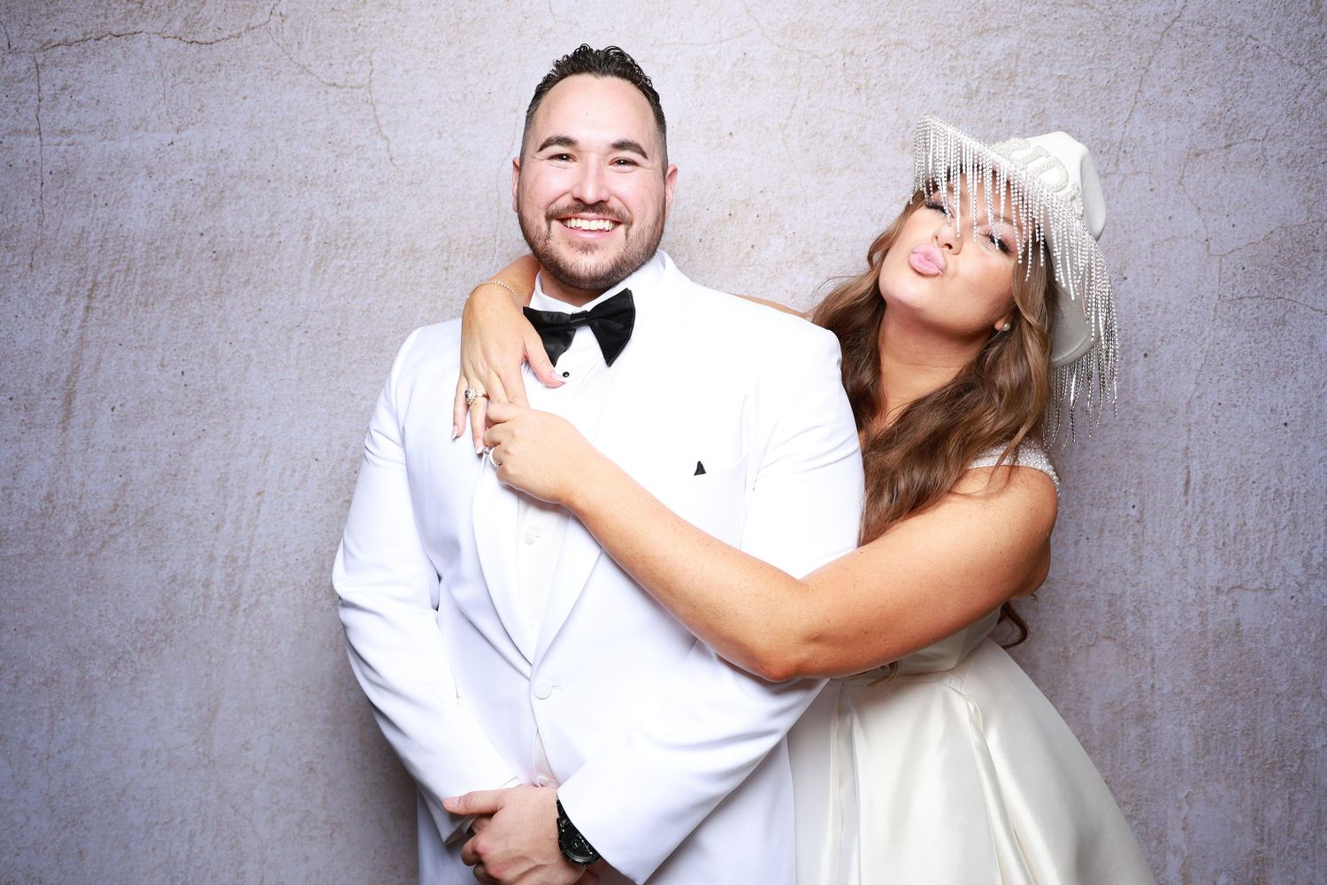 Candid photo booth moments capturing joyful laughter and natural interactions.