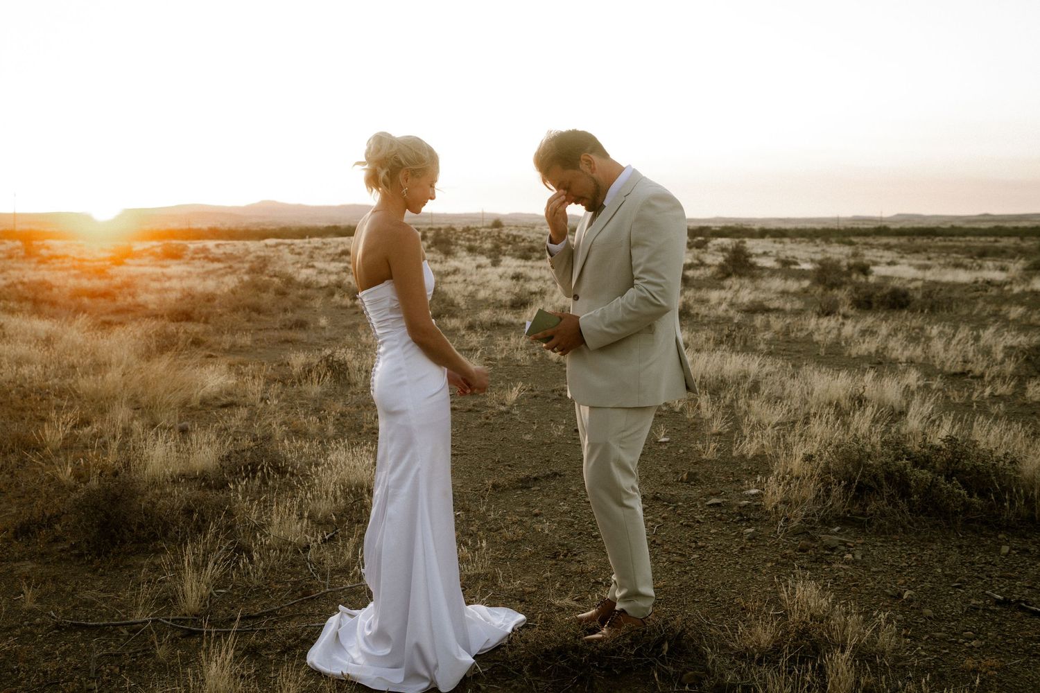 Bride reading vows to groom outdoors in Garden Route wedding photo