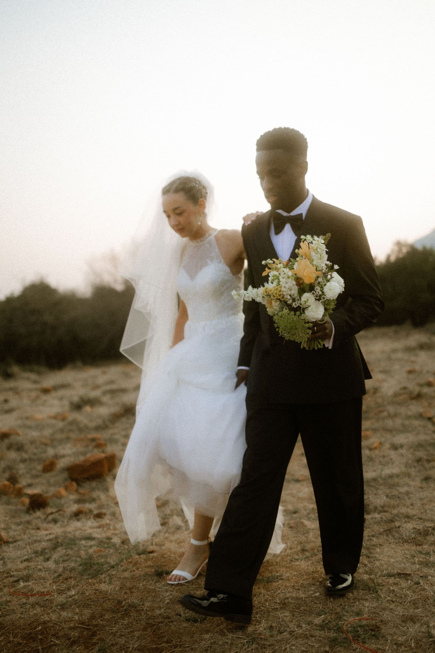 Bride and groom walking outdoors at sunset in South Africa nostalgic wedding photography
