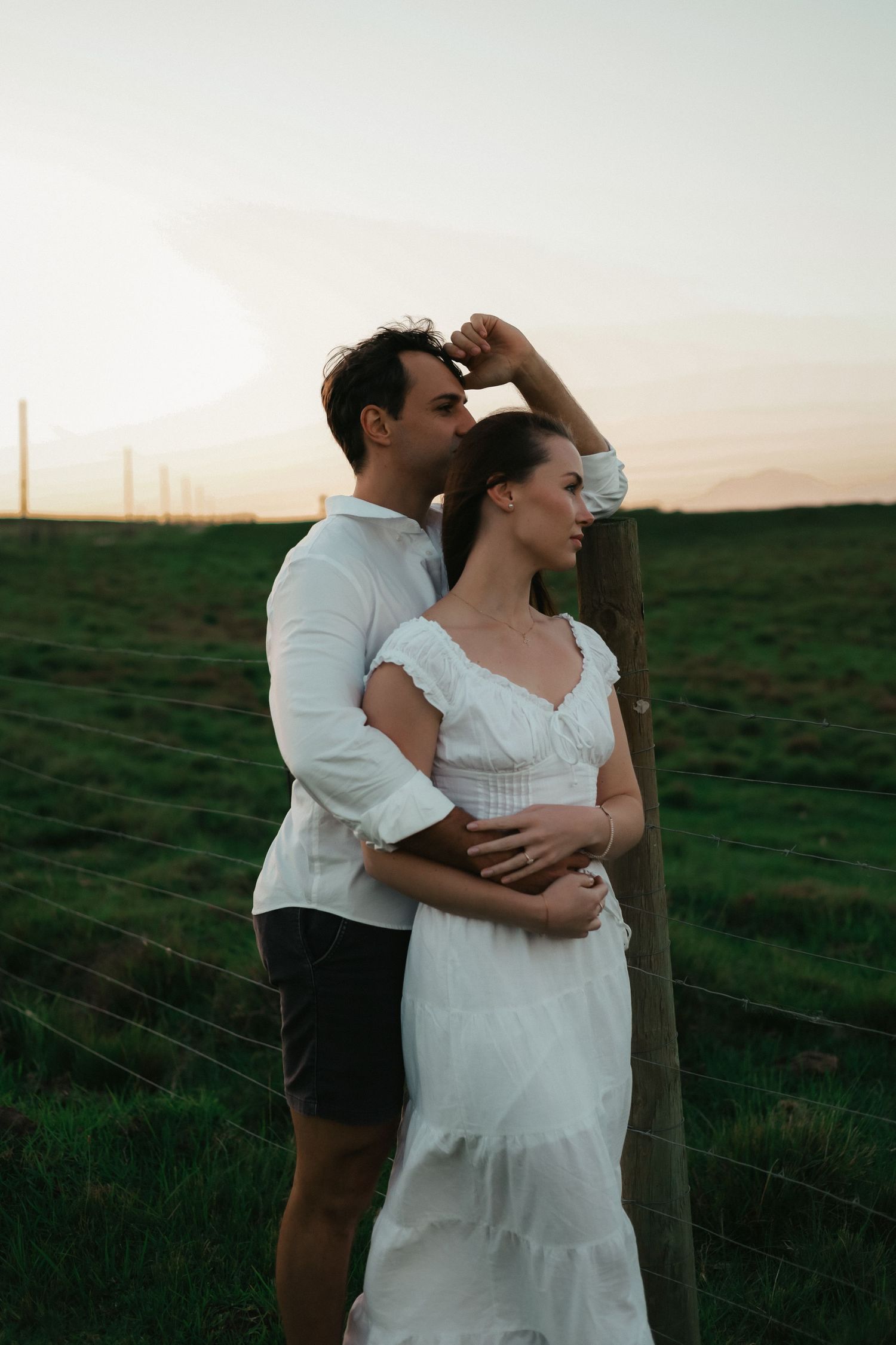 Couple embracing in green field at sunset, Garden Route couple shoot photographer