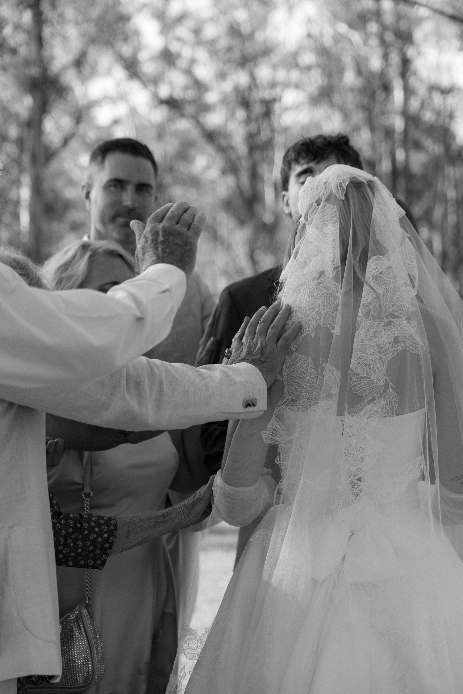 Bride and groom with guests at outdoor wedding in Garden Route
