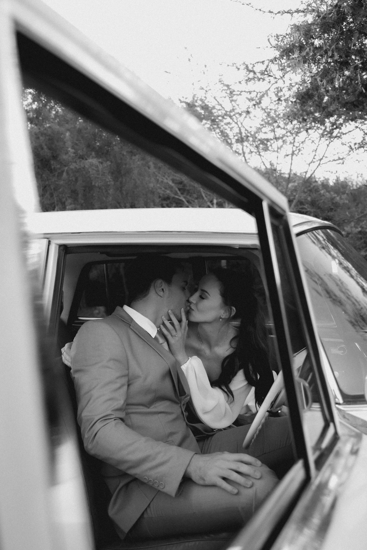 Couple sharing intimate moment inside vintage car, Garden Route cinematic wedding film