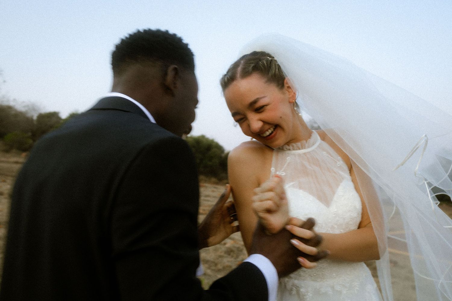 Bride and groom holding hands outdoors in Western Cape wedding photography