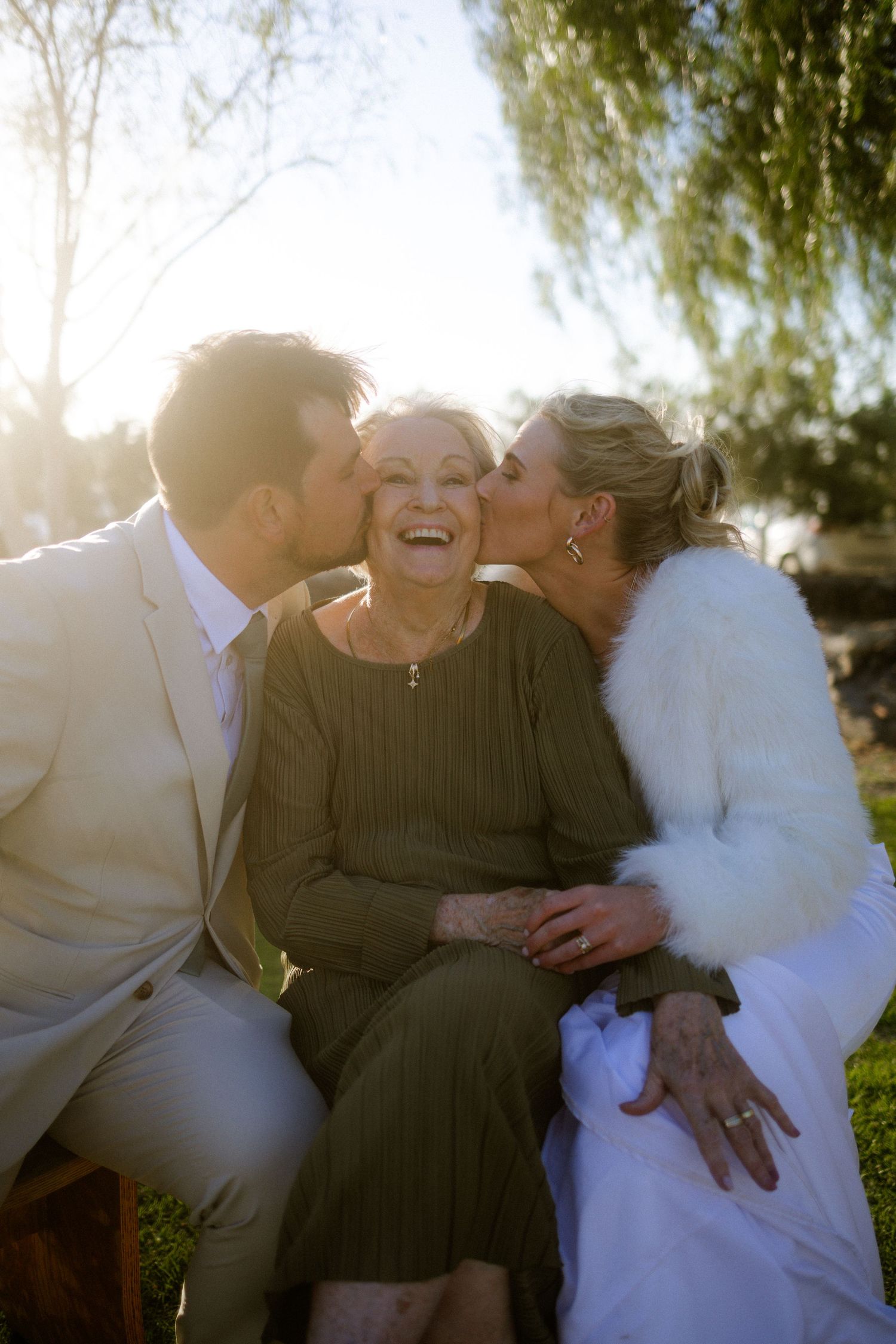 Bride and groom kissing grandmother outdoors, Garden Route engagement photographer