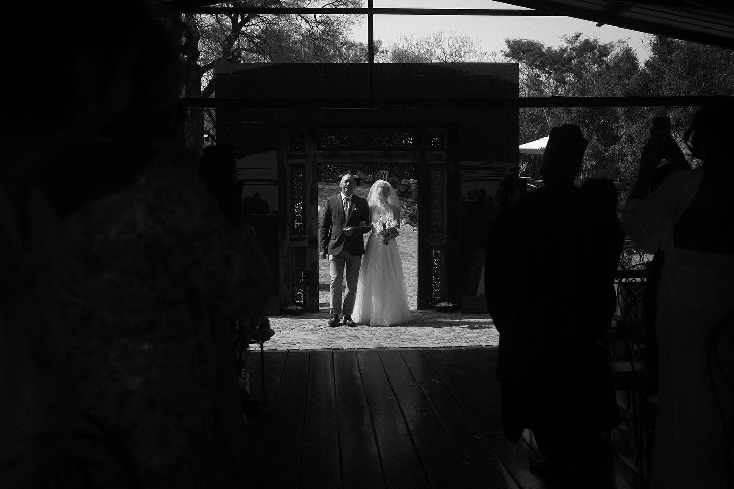 Bride and groom walking down aisle in Garden Route wedding film by Crimson and Vow