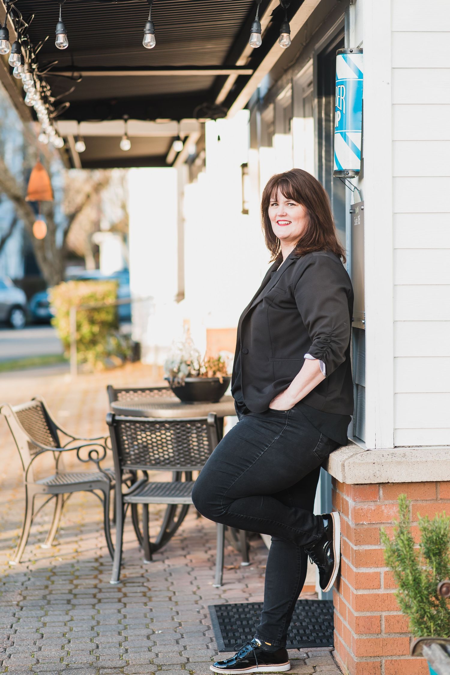 Cheri in front of Nic's Barbershop in Mukilteo