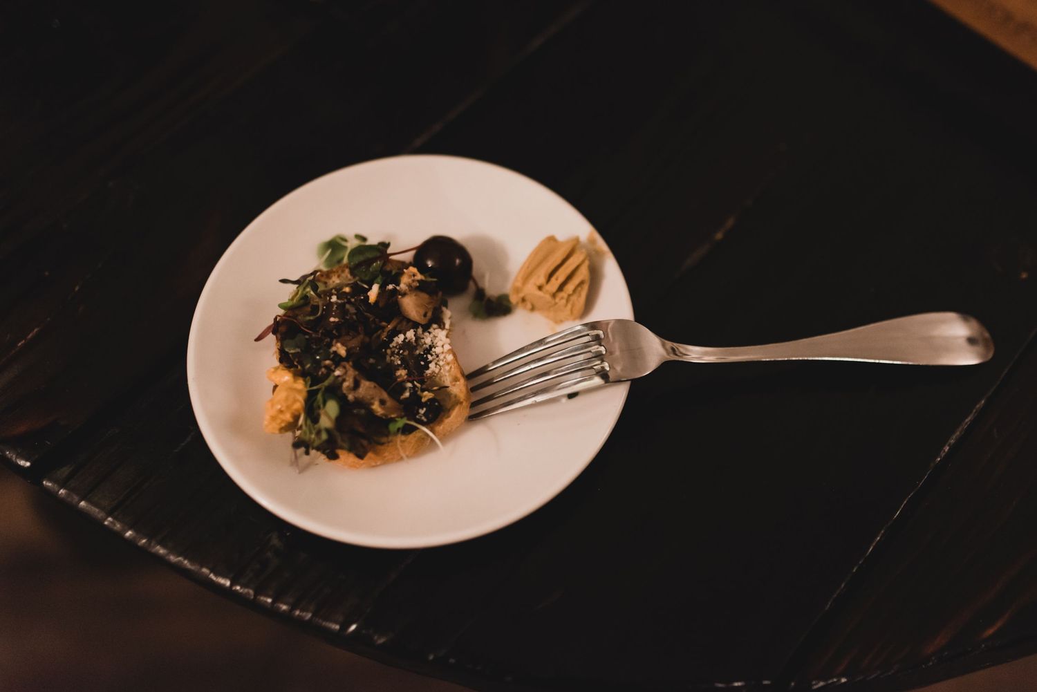 Sage + Cinder vegan restaurant food on plate with fork