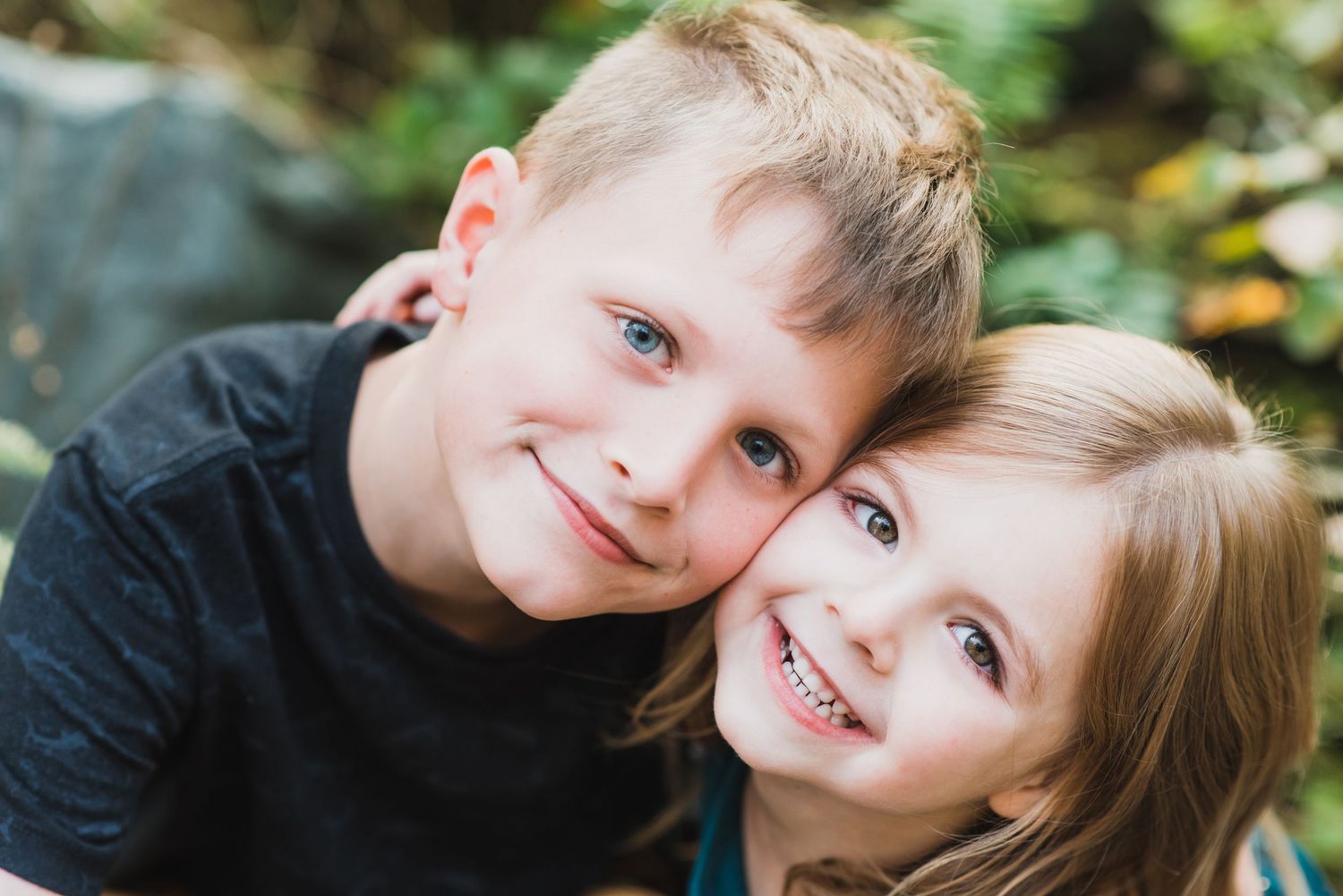 A series of candid outdoor portrait photographs showing playful expressions and natural smiles against a blurred background.