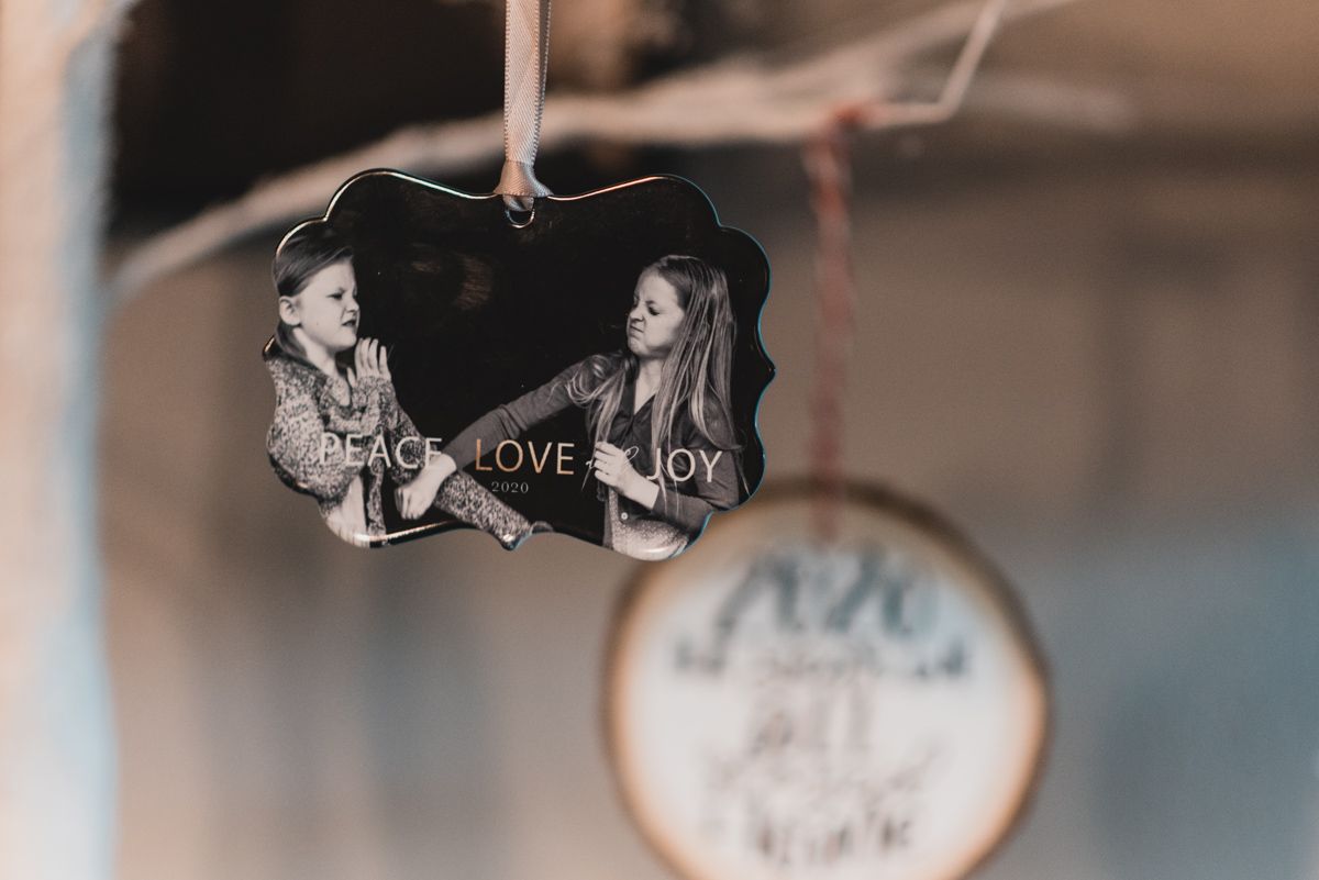 photo ornament with image of two girls fighting and words Peace Love Joy 2020