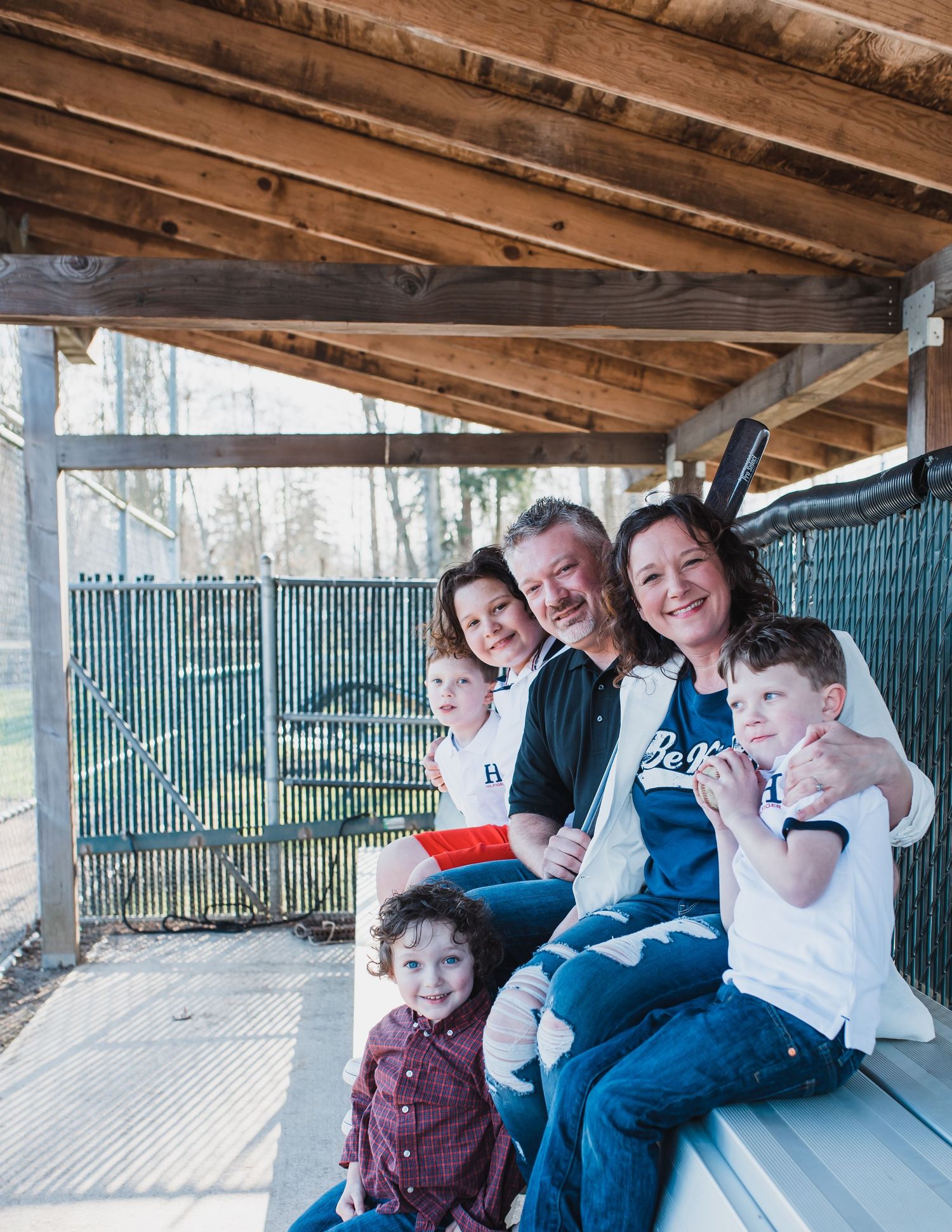 Family portrait in dugout at Mukilteo Little Leage fields