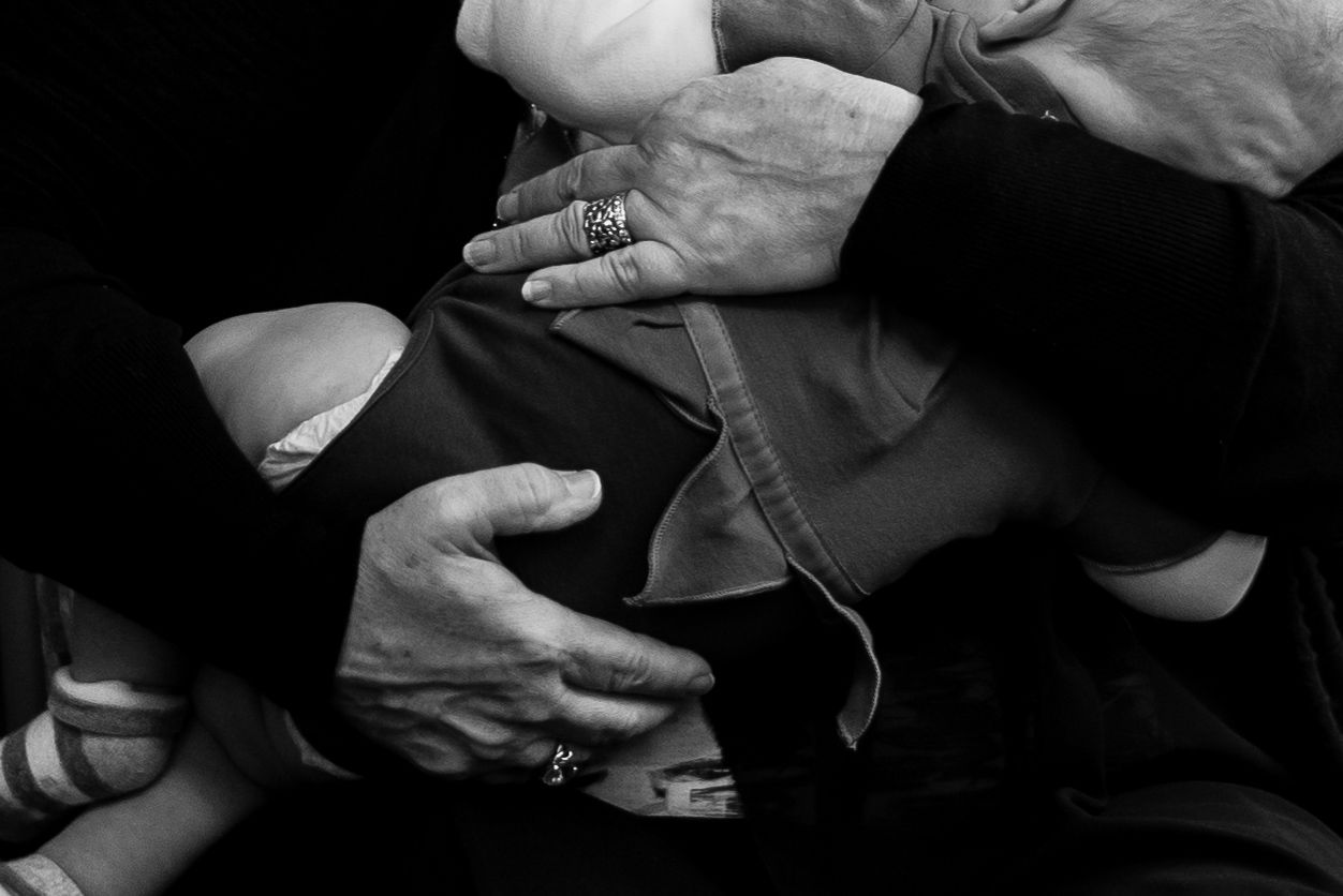 Black and white close-up photos showing hands holding and playing a musical instrument.