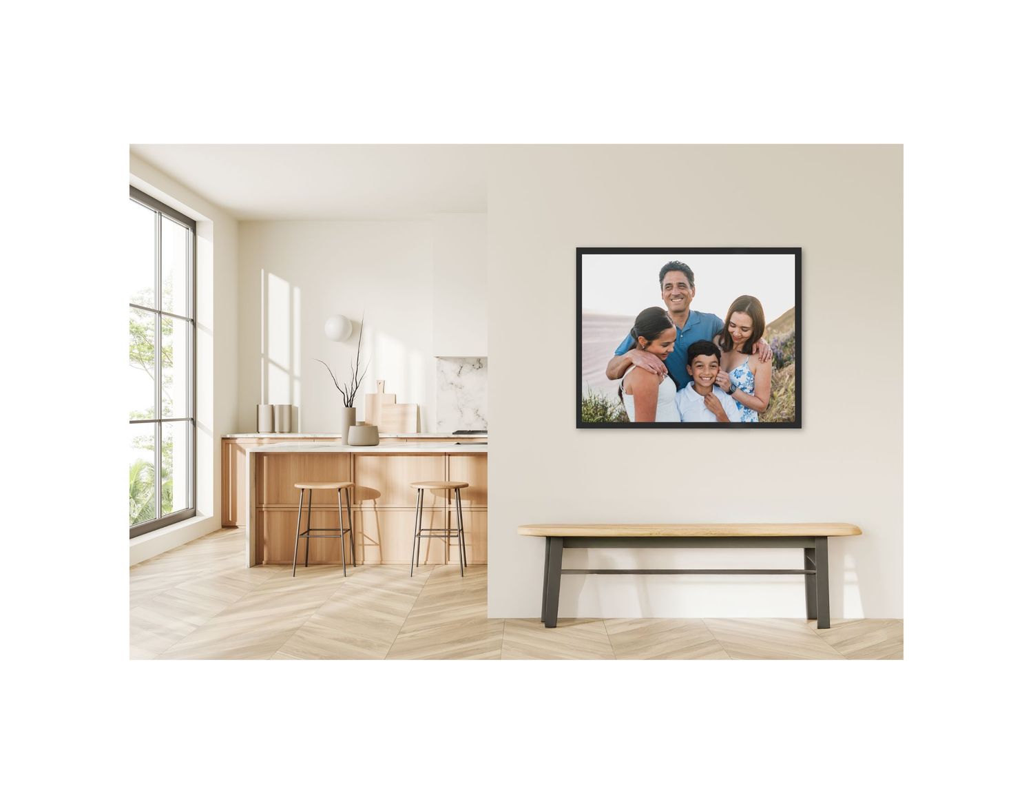Modern interior with a wooden bar counter, window, and large framed family photograph on a white wall. Family is on Whidbey Island, WA.