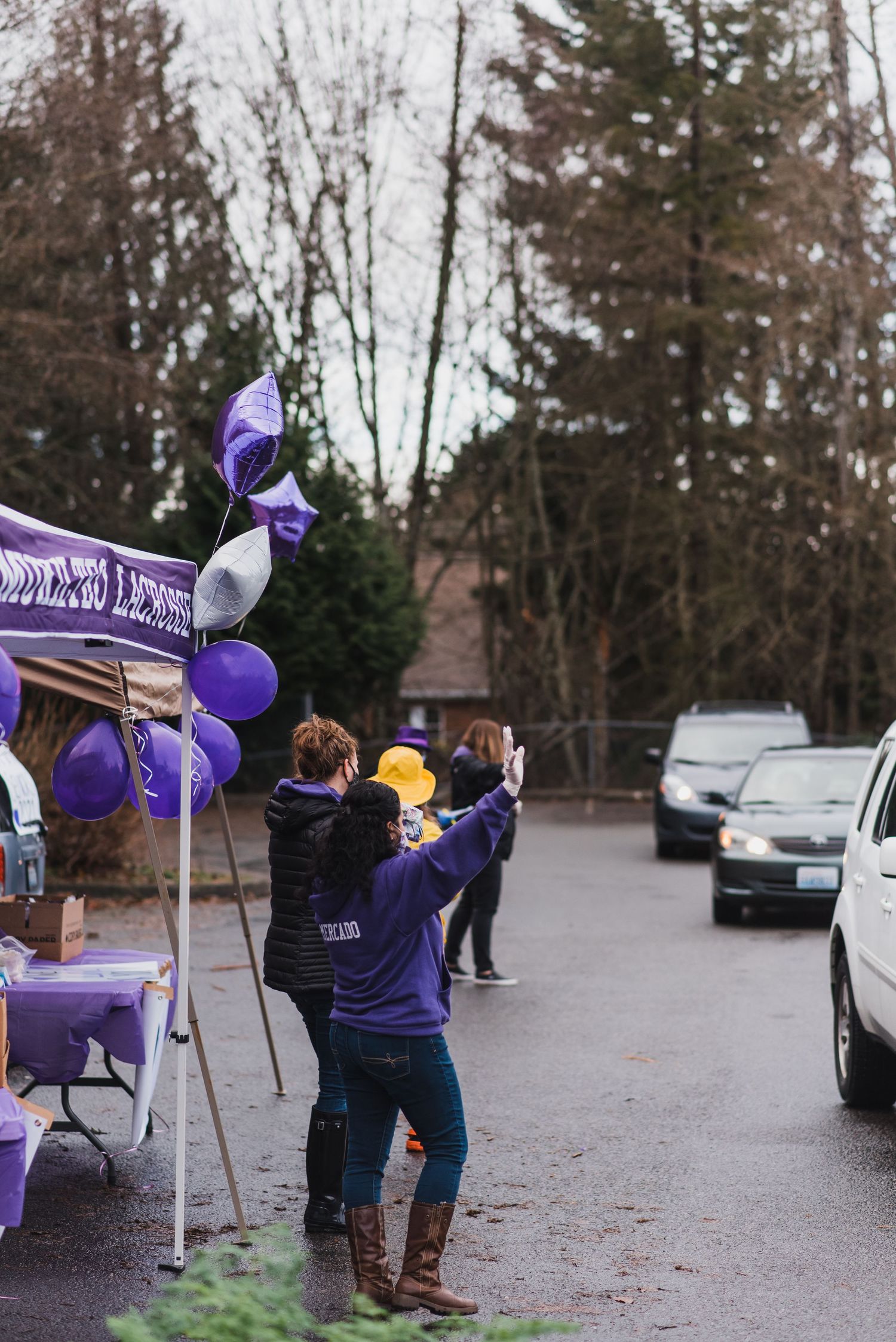 Kamiak high school parents handing out gift bags to seniors