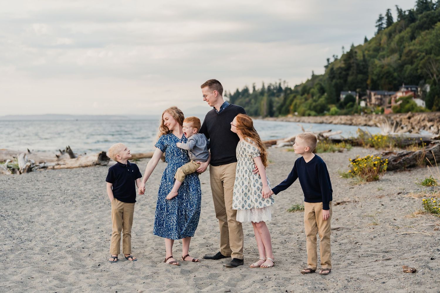 A series of beachside photos showing people enjoying a scenic coastal landscape with evergreen trees and rocky shores.