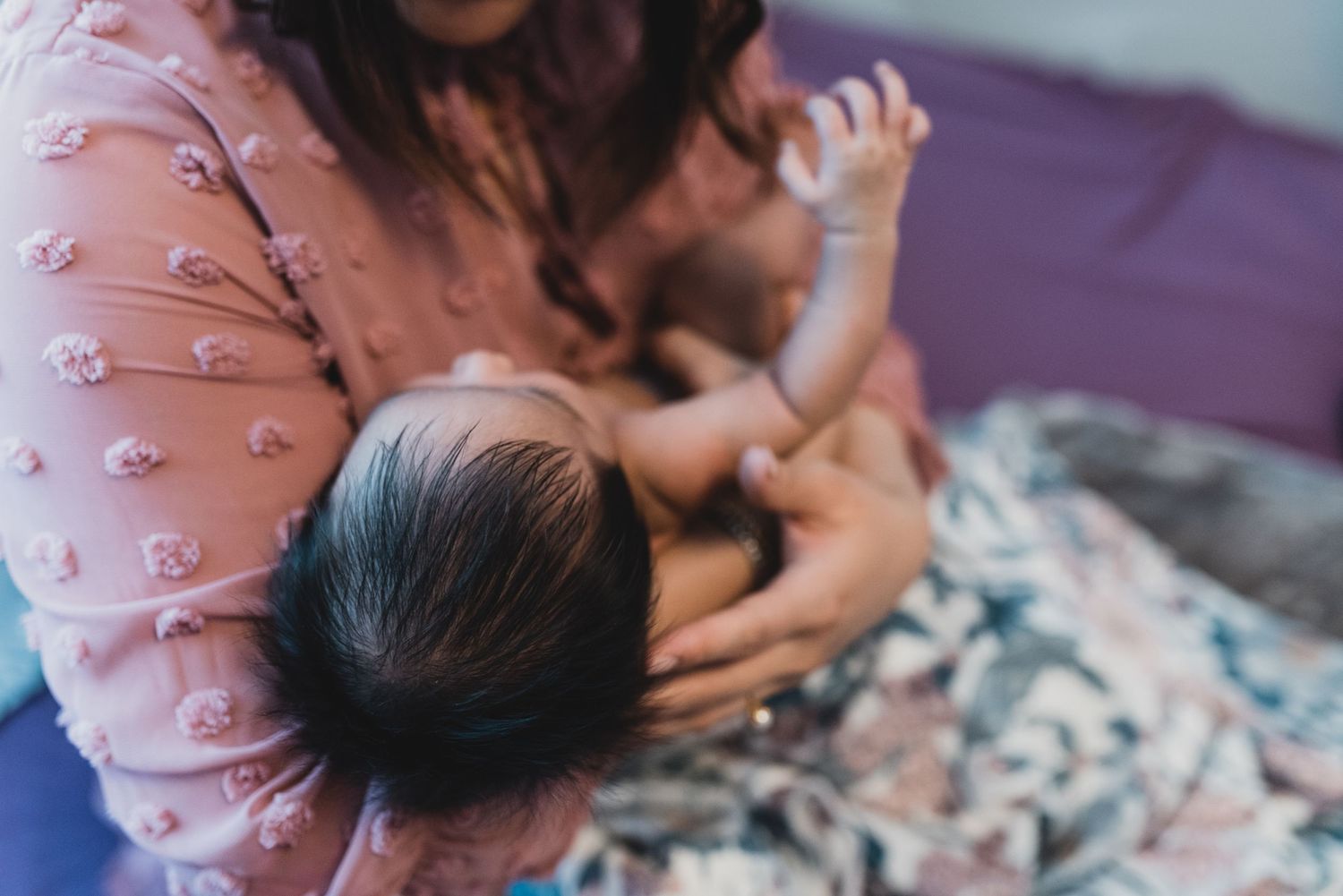 Tender family cuddles during an indoor lifestyle photoshoot.