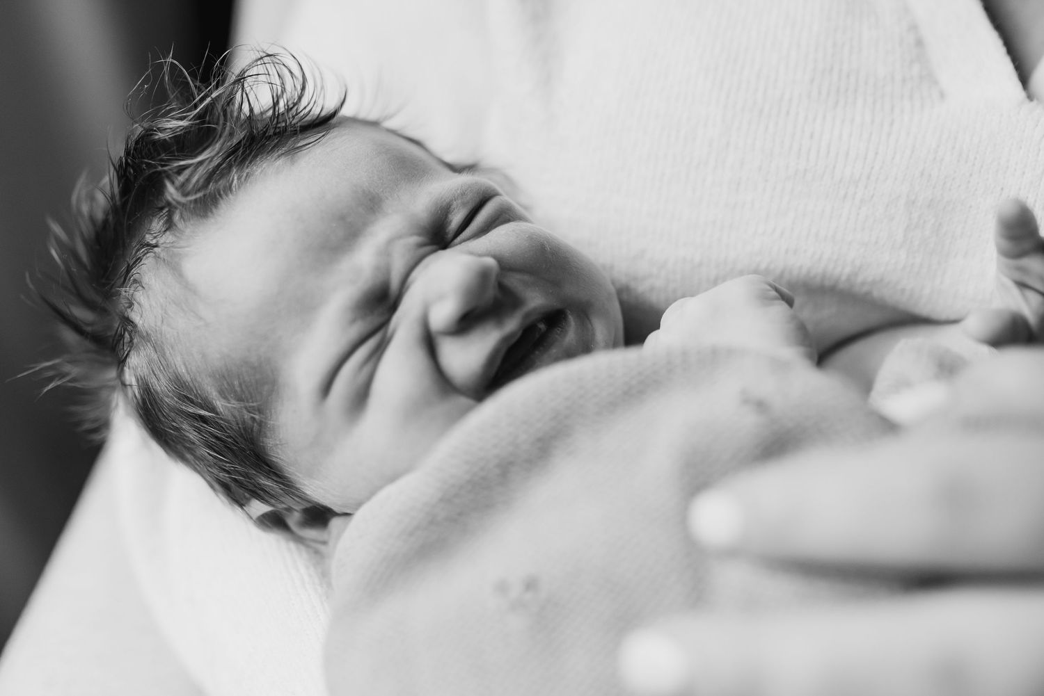 A black and white photo sequence shows a sleeping baby in different peaceful positions.