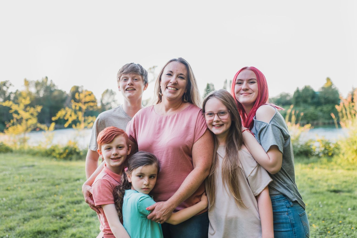 Joyful family moment captured in outdoor evening photoshoot.