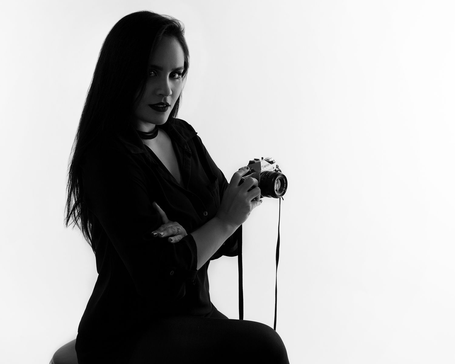 A black and white photo collage showing a person in various poses against a white background.