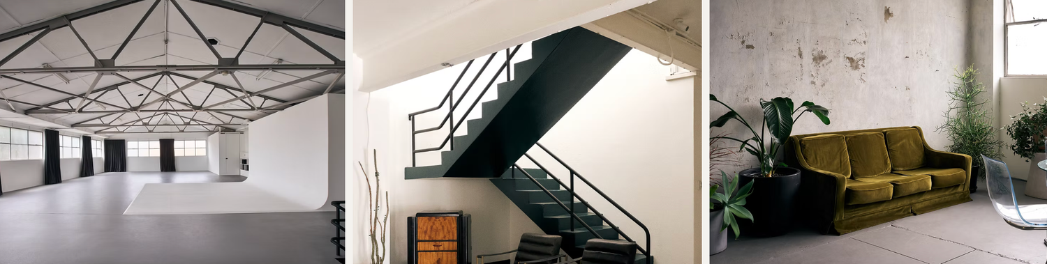 Modern industrial interior spaces featuring high ceilings, metal staircase, and olive green sofa against textured wall.