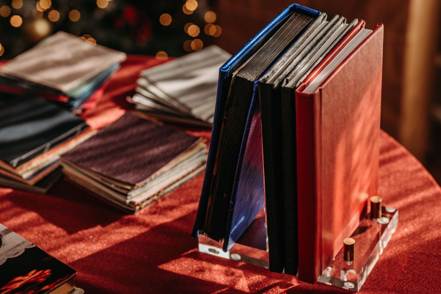 Vinyl records displayed in wooden crates at a record store with warm lighting and bokeh effects in the background.