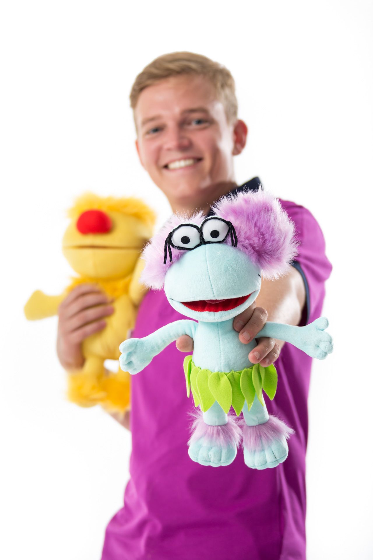 A First Choice Holidays rep showing off plush toys
