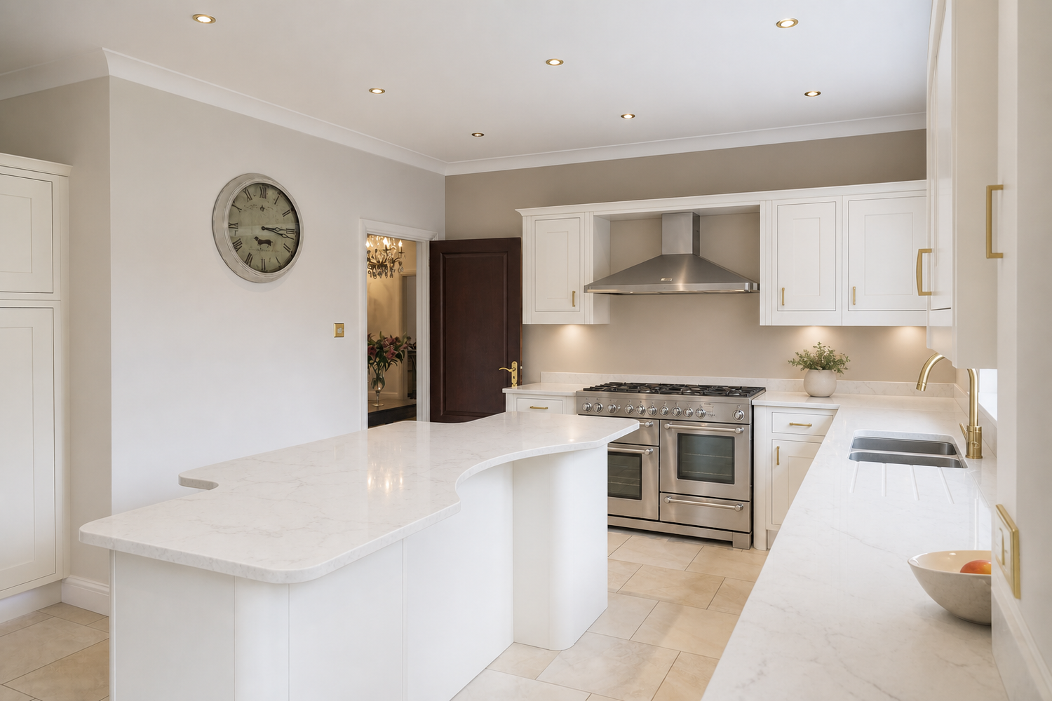 Modern white kitchen with marble island, stainless steel range, hood vent, and neutral tile flooring in bright open layout.