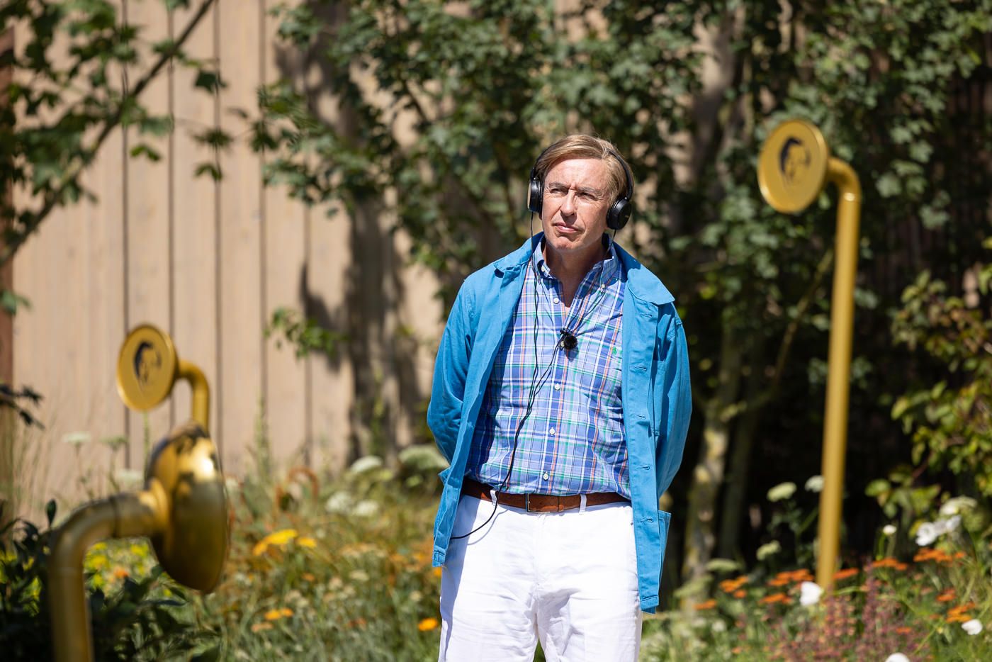 Alan Partridge walking solo through the sound-inspired garden at Hampton Court