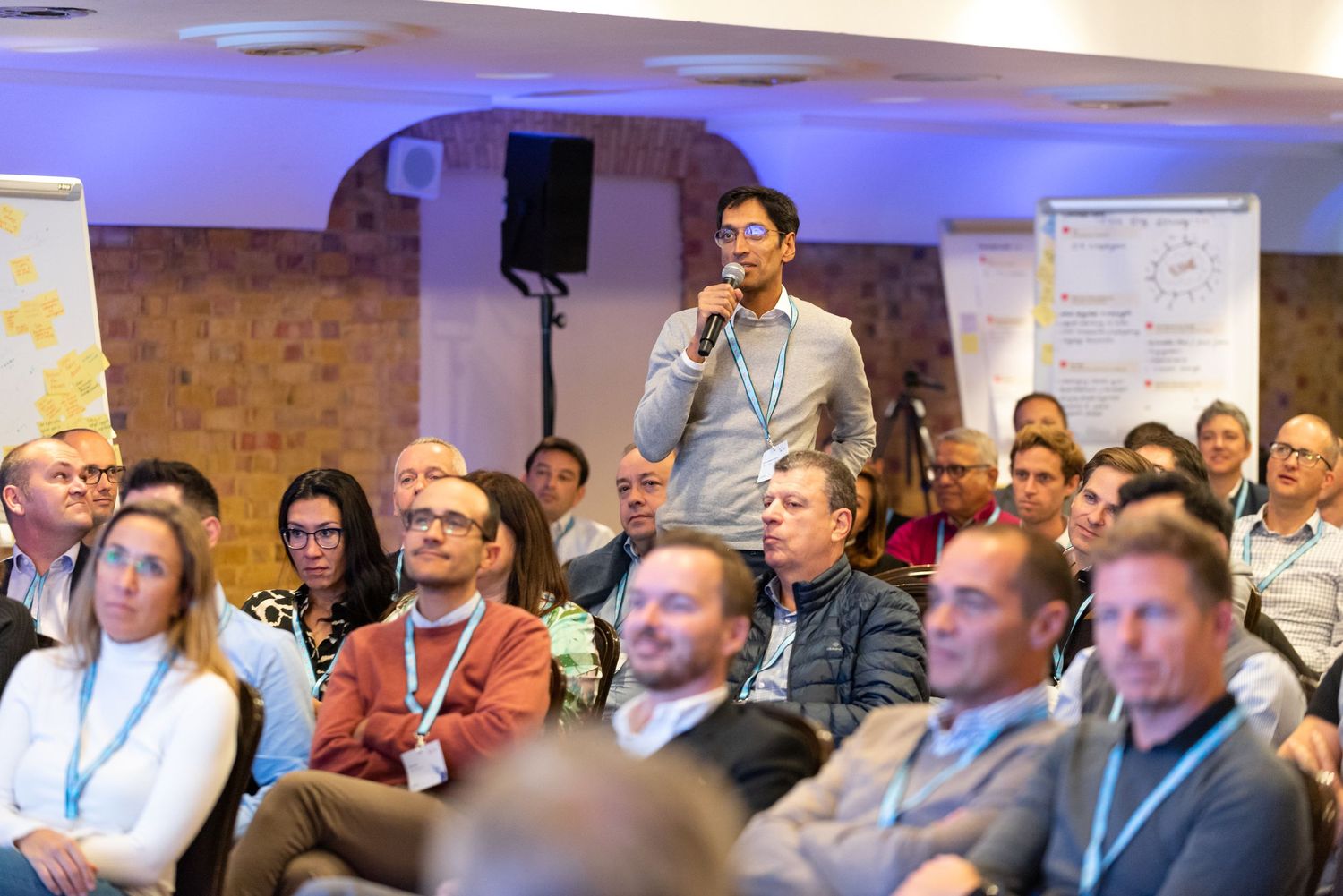 Speaker presenting to delegates during an international business conference and networking event