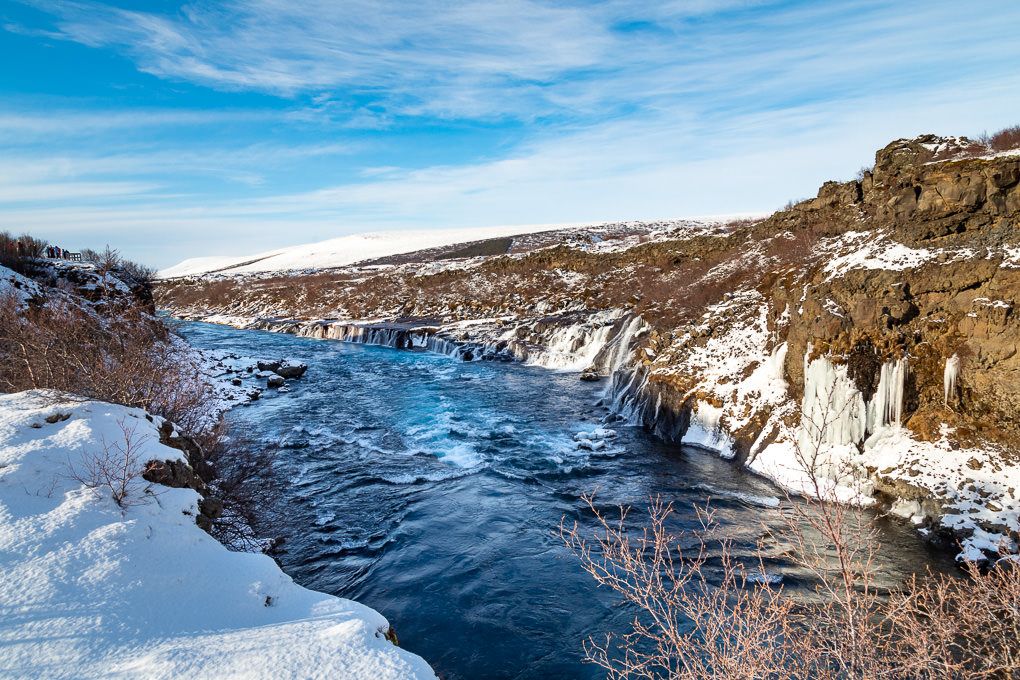 Travel photography of Iceland's Hraunfossar Waterfalls during the winter.