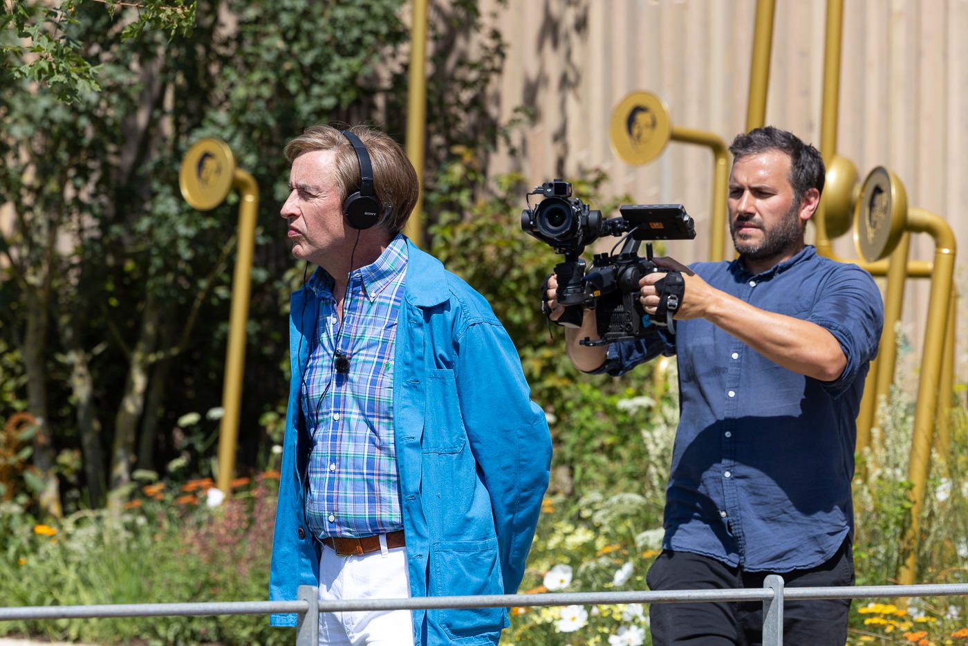 Behind-the-scenes photo of Alan Partridge filming in the garden