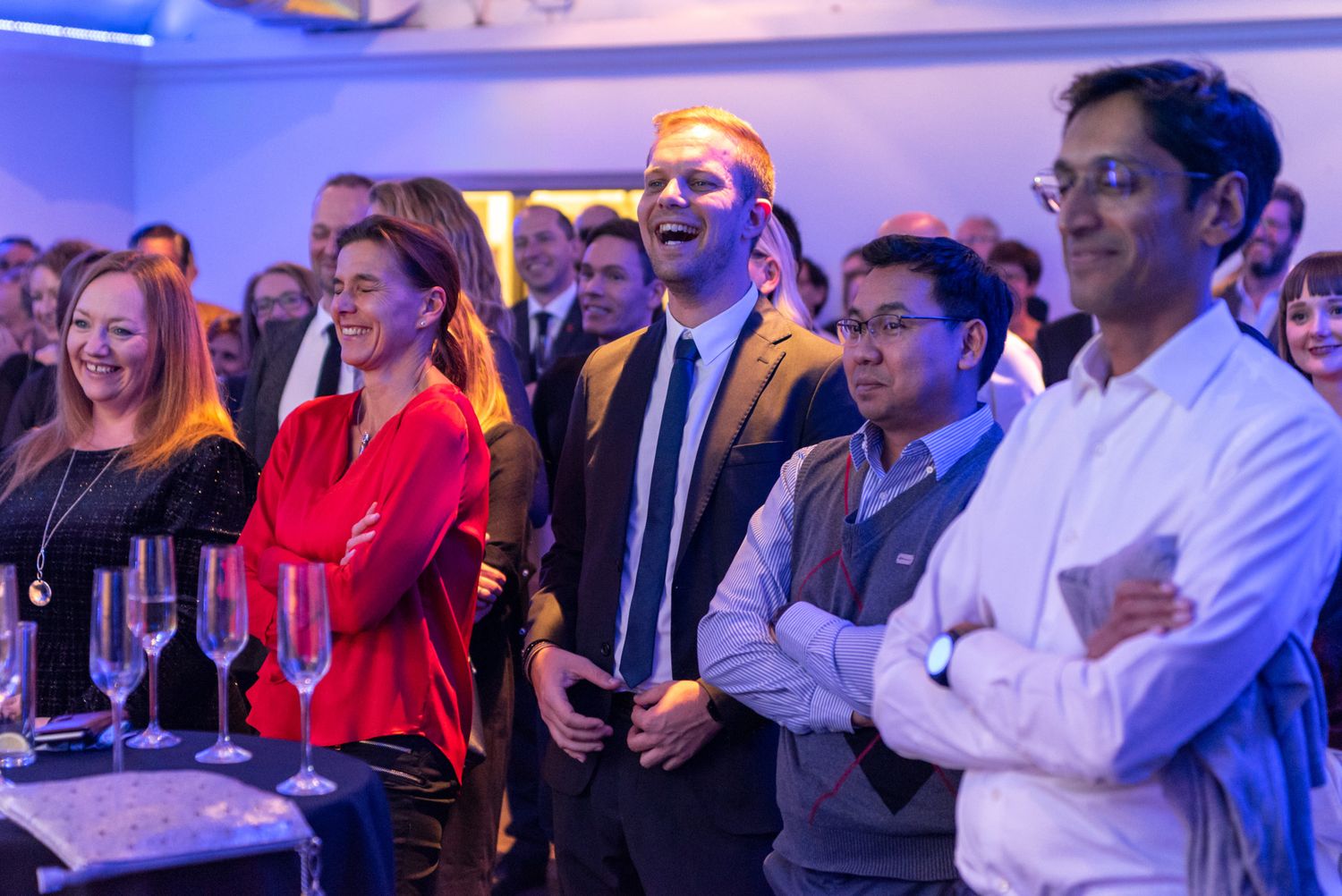 Delegates watching a live presentation at a corporate conference in Palma de Mallorca, capturing audience engagement during a business event