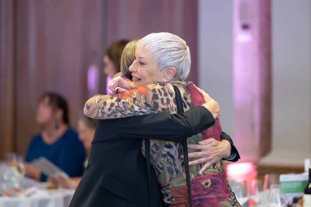 People sharing warm embraces and emotional moments at the RHS Britain in Bloom Awards 2025.