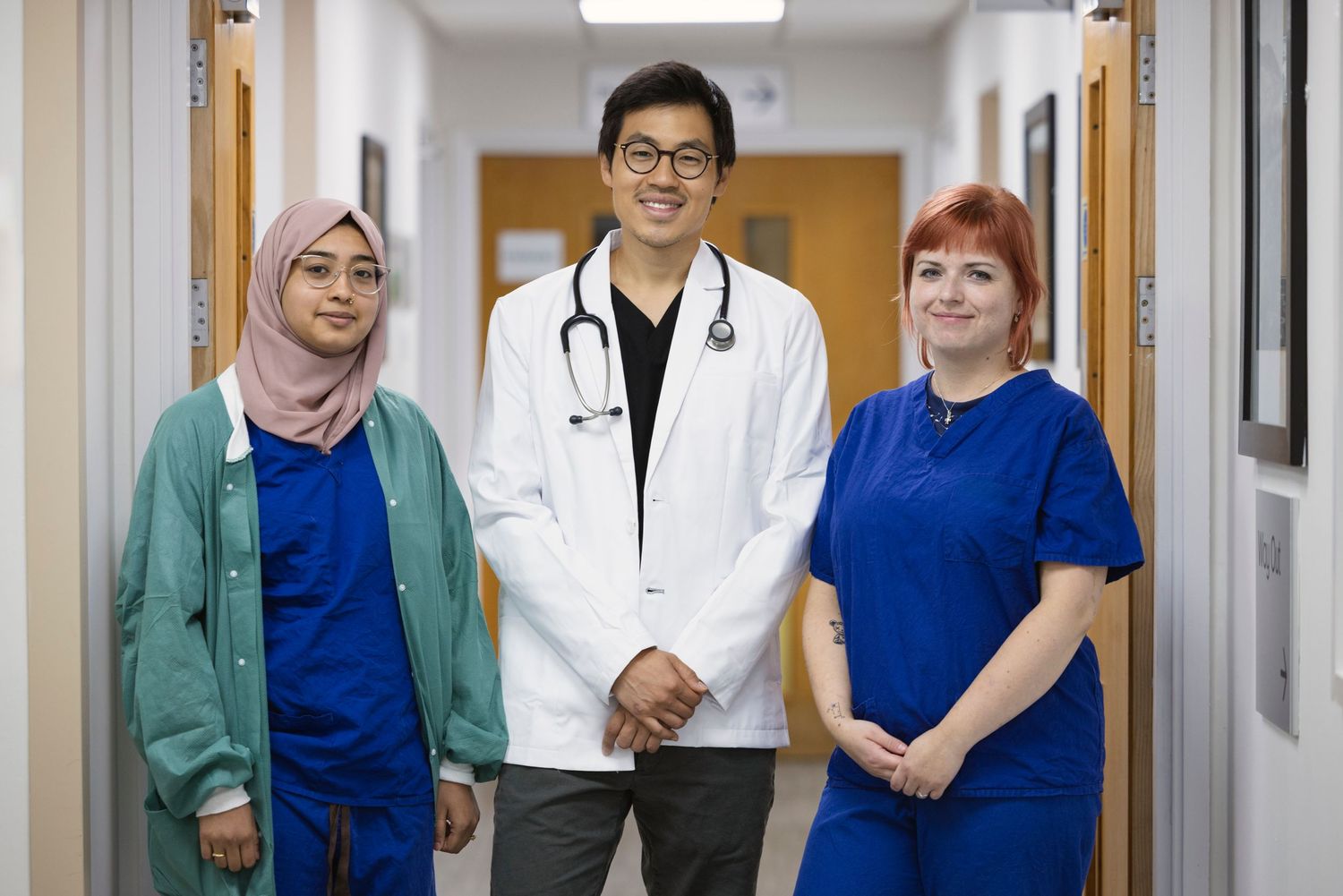 Professional team portrait of healthcare staff including doctor and nurses, photographed for hospital marketing and healthcare communication
