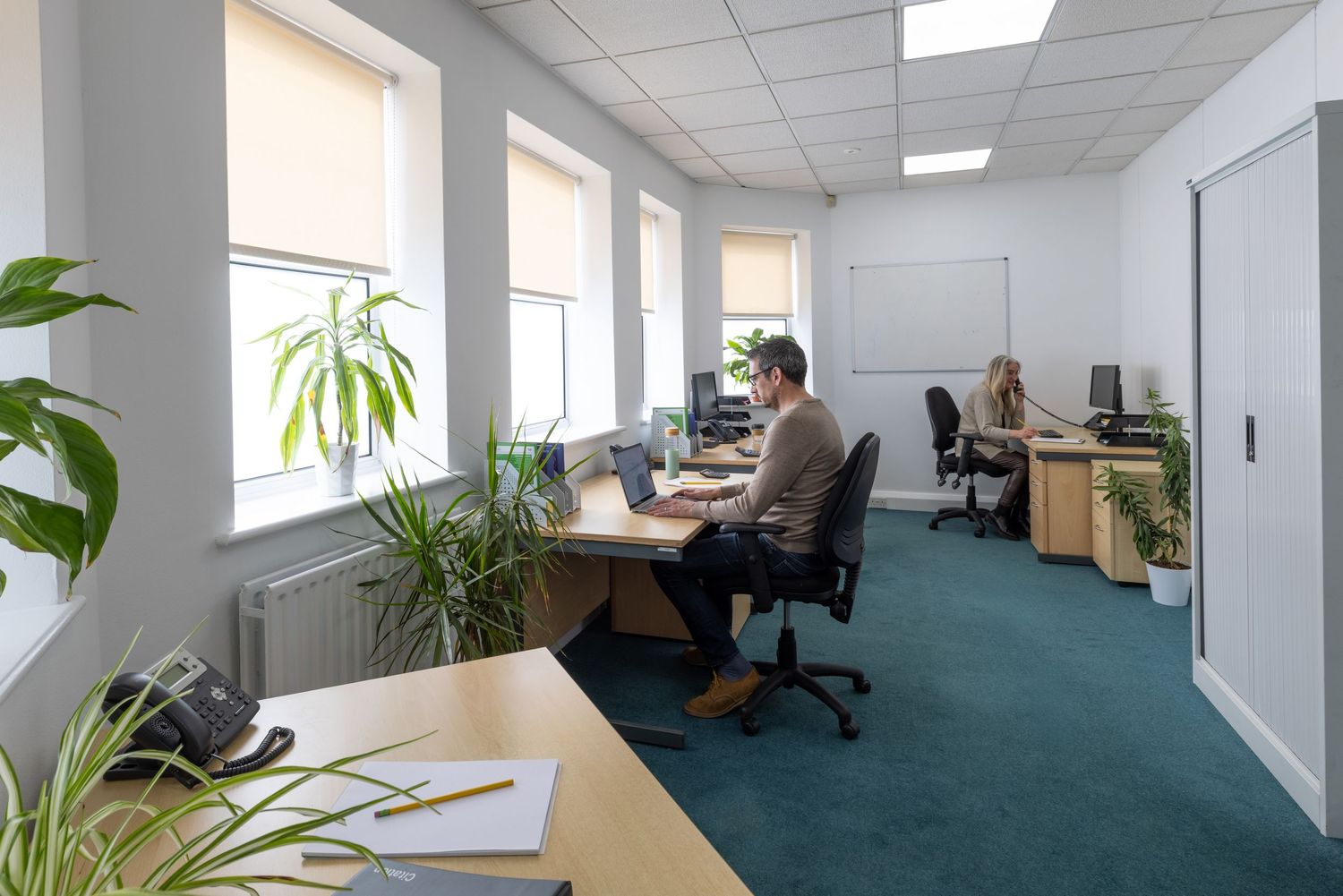 Corporate lifestyle photography showing professionals working in a modern office environment.