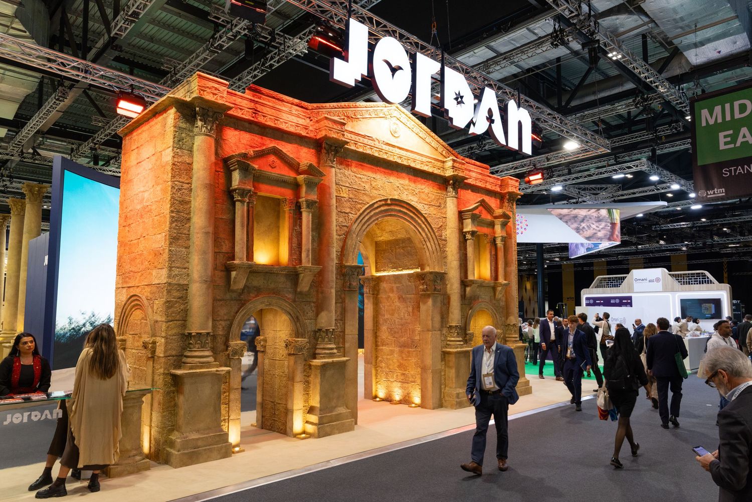 Visitors exploring the Jordan tourism stand at an international travel and tourism exhibition