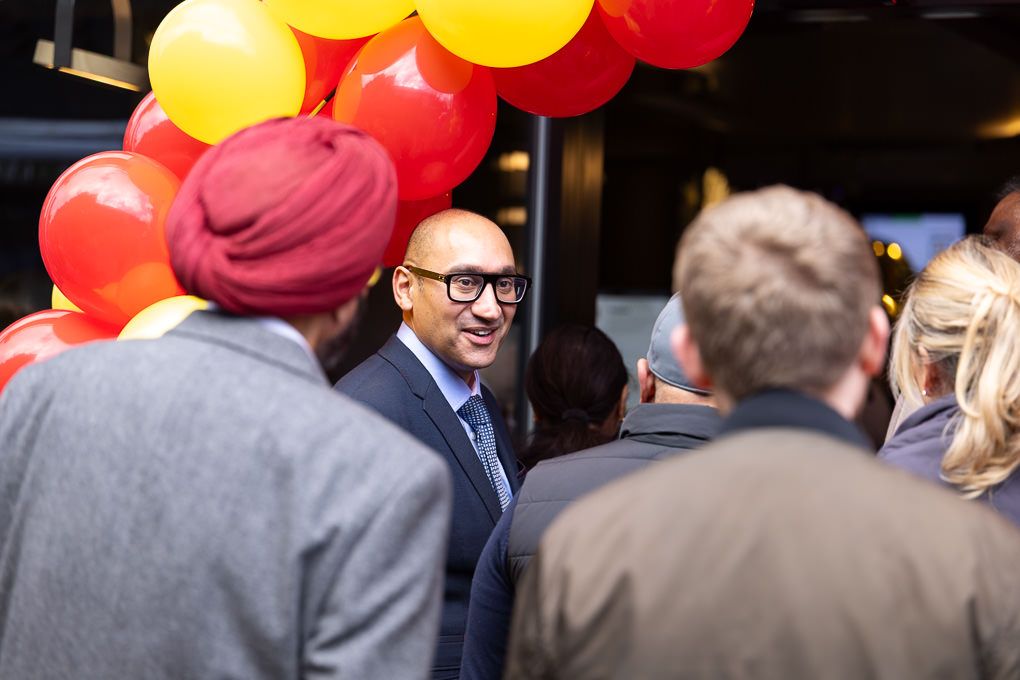 Crowd at the McDonald’s Rickmansworth restaurant opening with red and yellow balloons, photographed for PR and press use during launch event