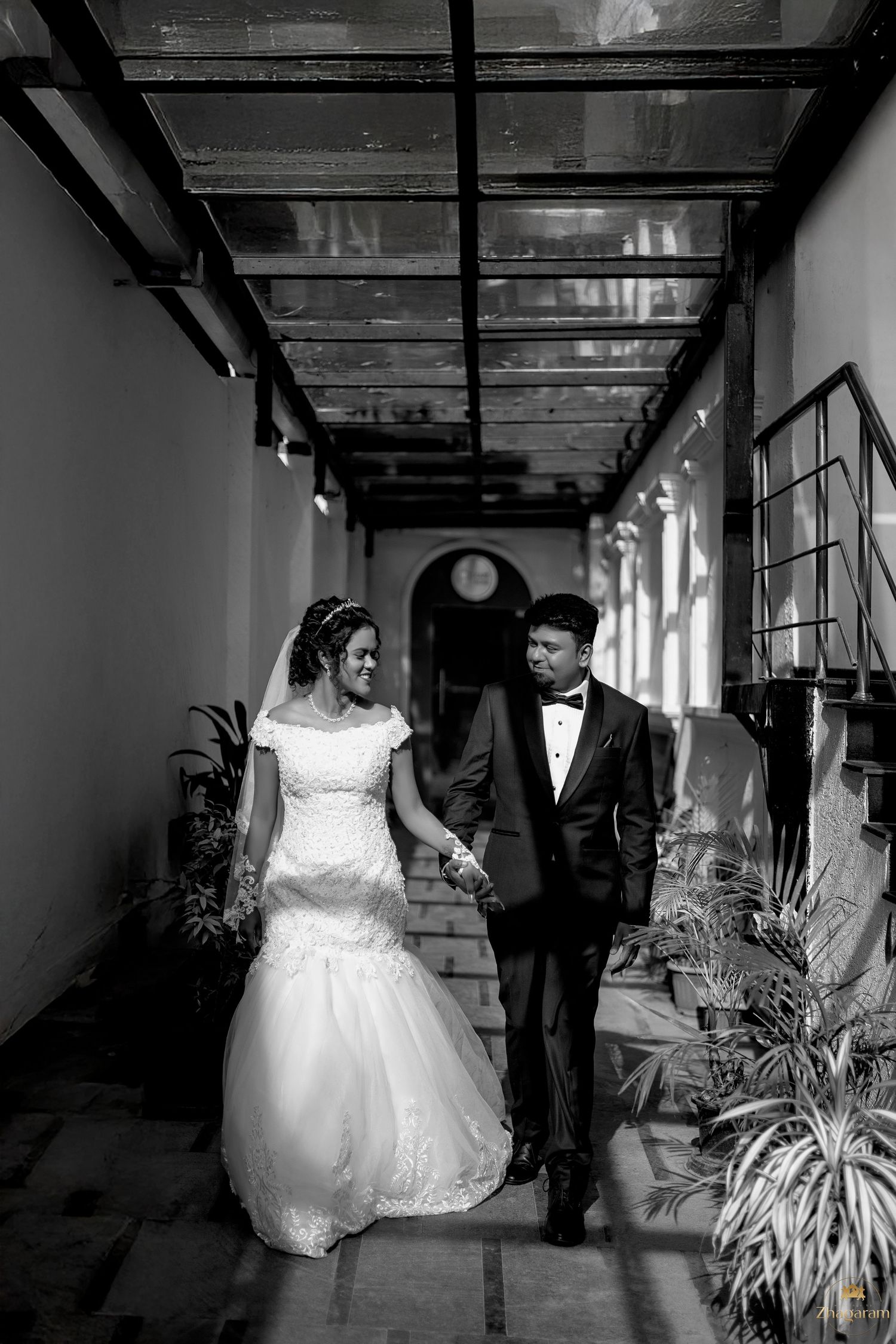 Bride and groom walking together in black and white candid wedding photography Chennai