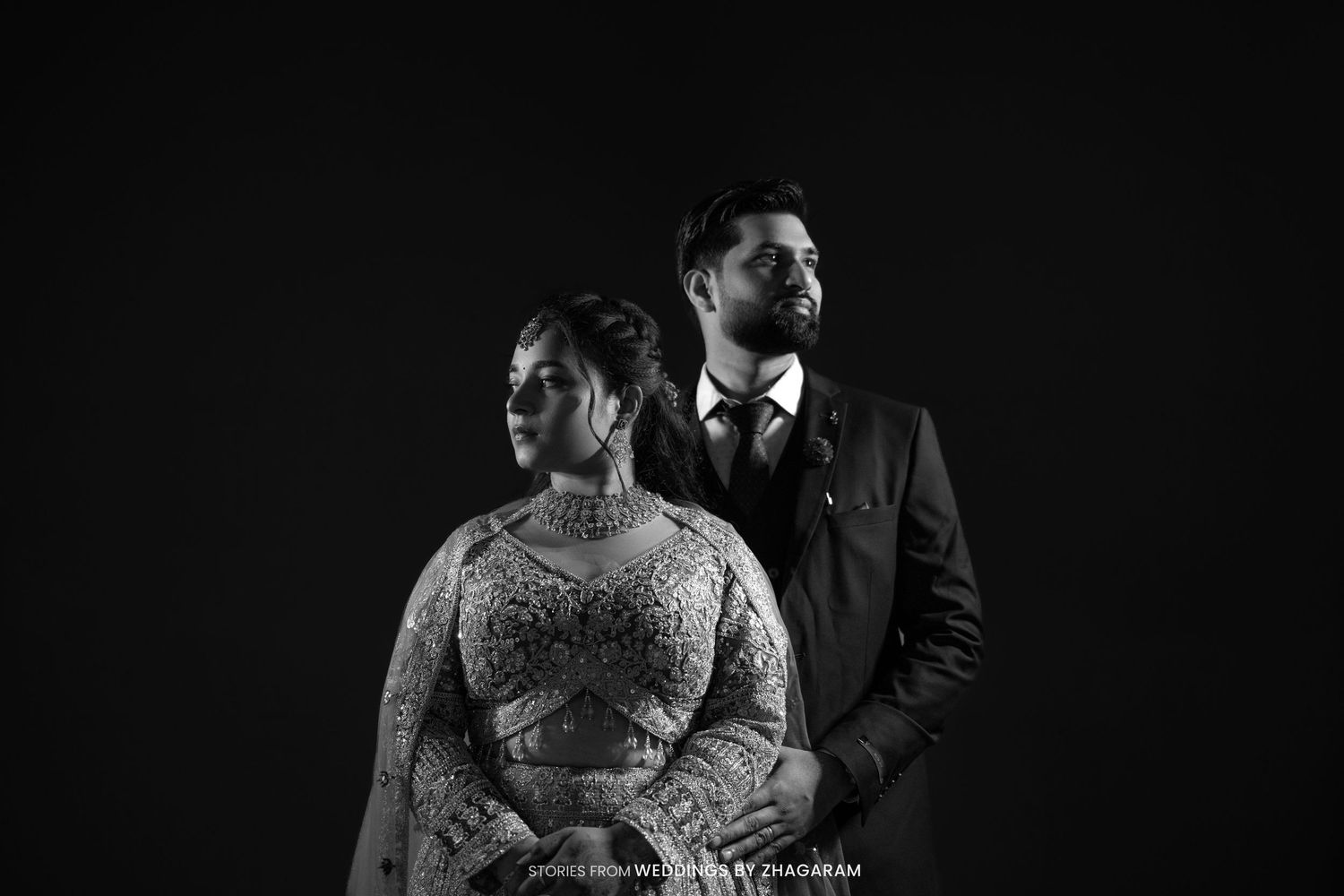 Couple in formal attire dramatic black and white studio portrait wedding photography by Weddings by Zhagaram