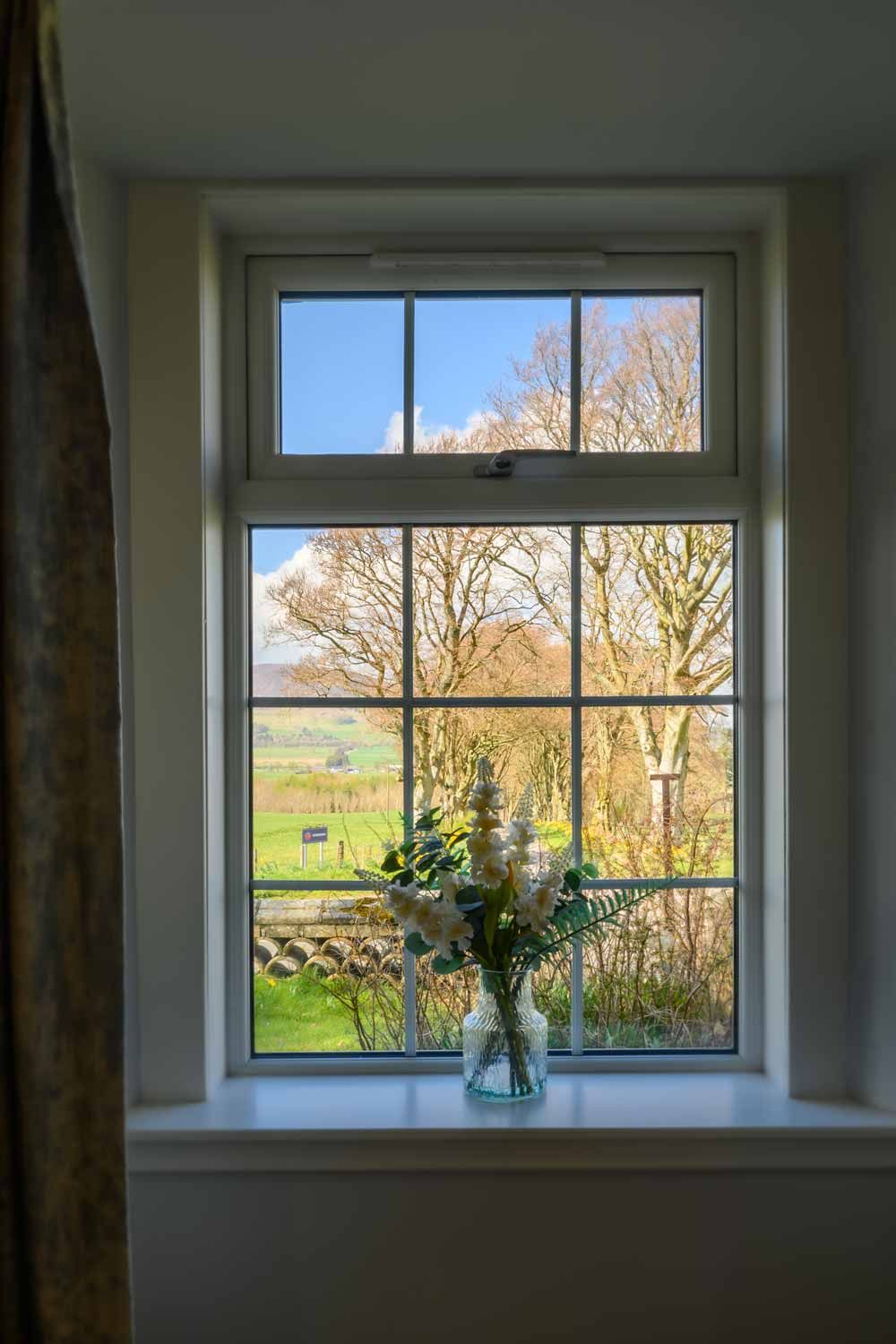 Bright interior real estate photography of a traditional cottage window in Lanarkshire Scotland.