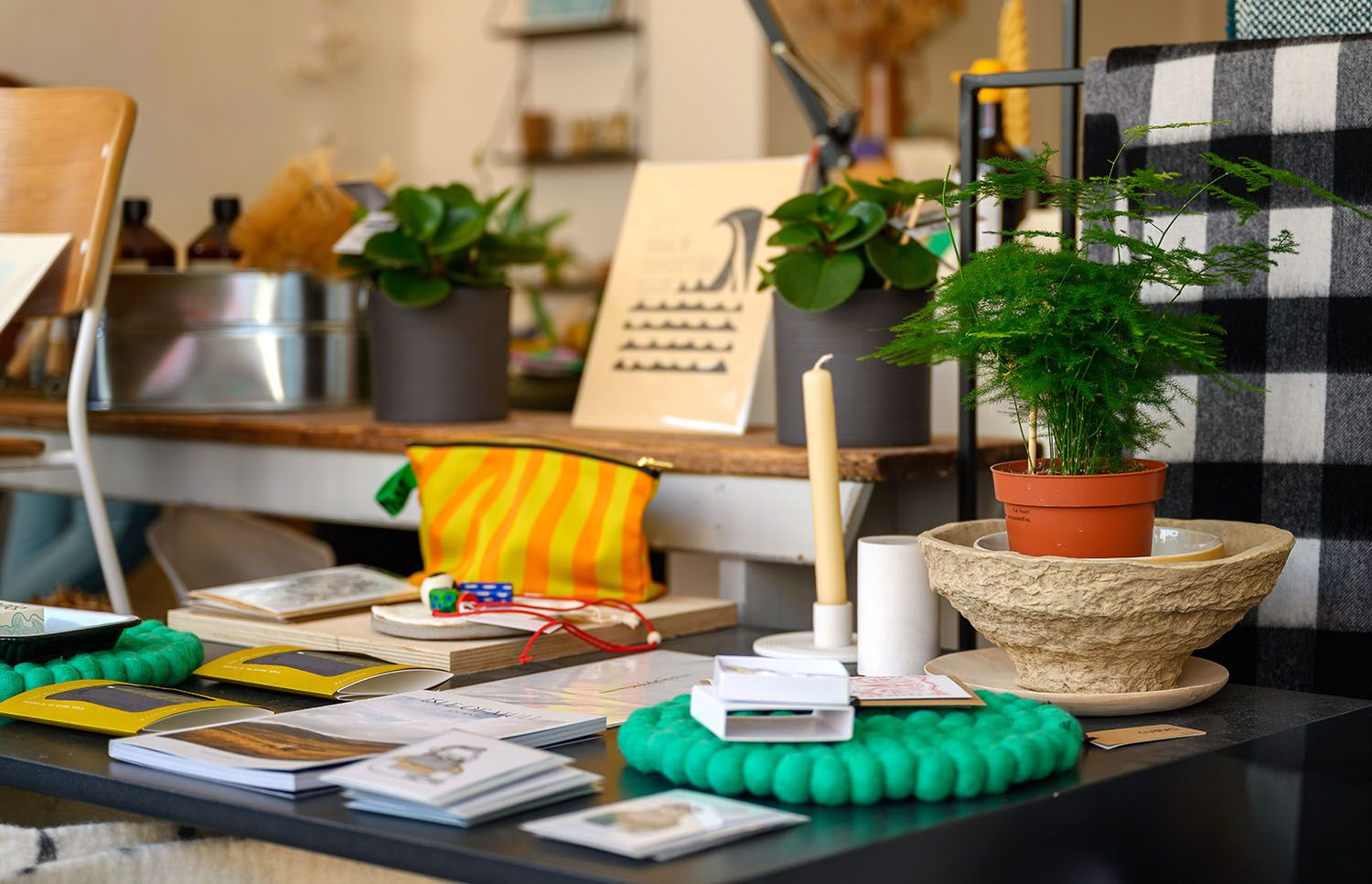 Interior of an independent gift shop in Oban, Scotland, displaying plants, stationery and handcrafted retail products.