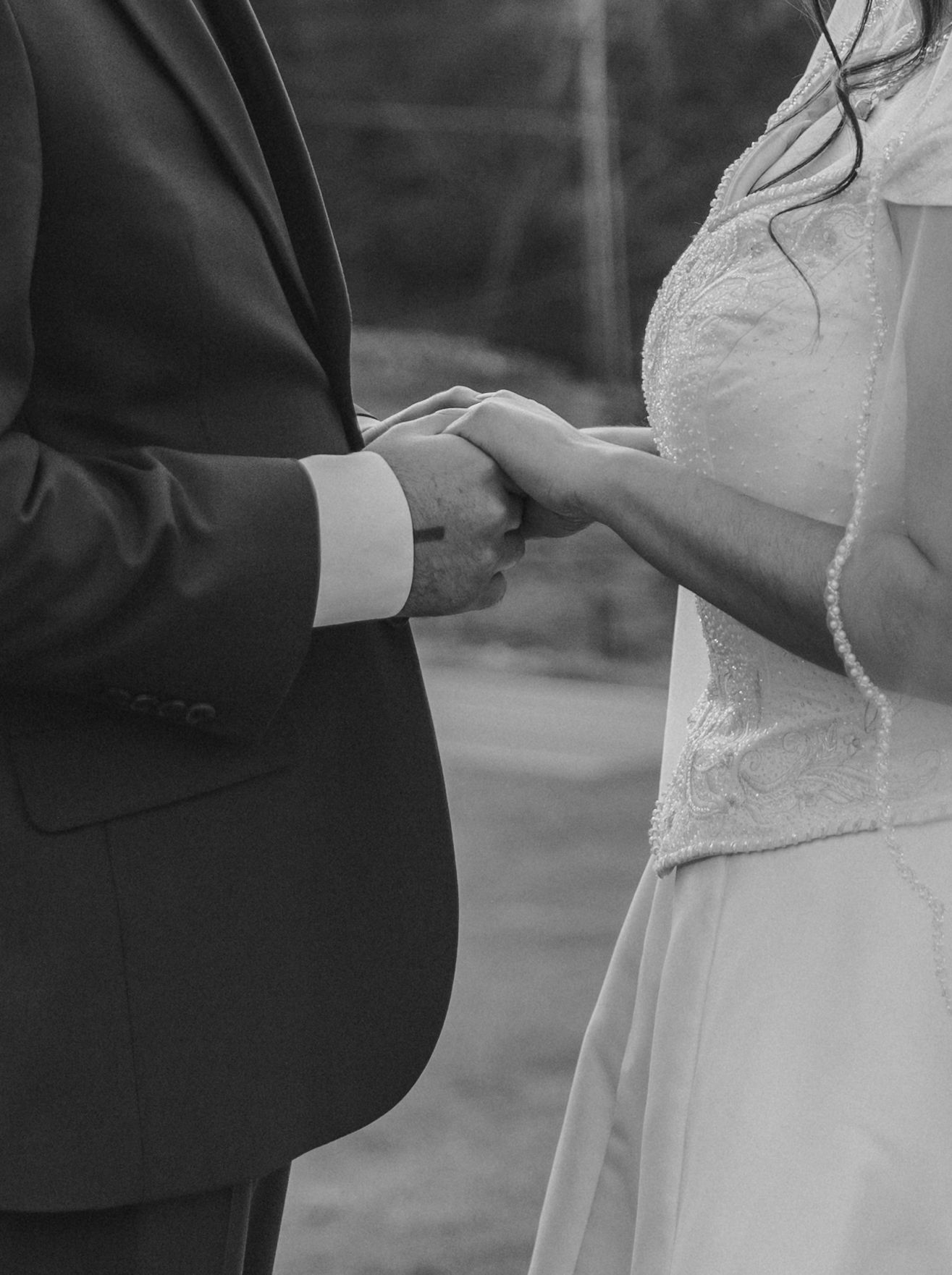 Black and White Wedding Holding Hands