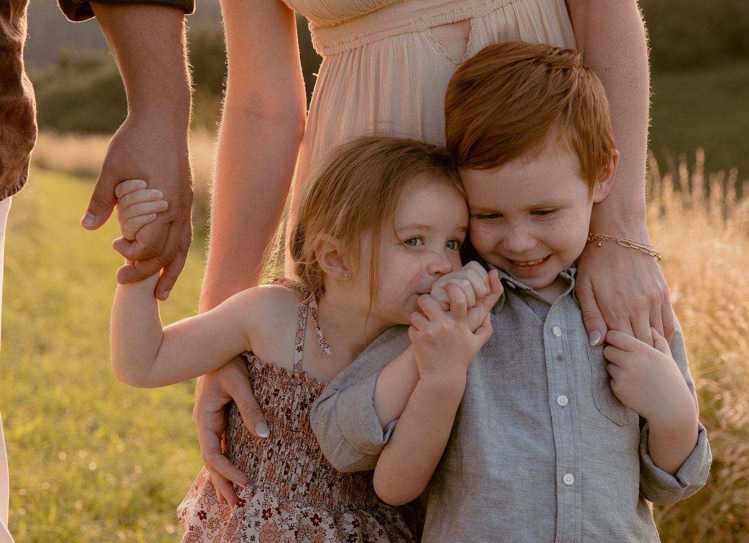 Candid family moments captured in warm evening light.