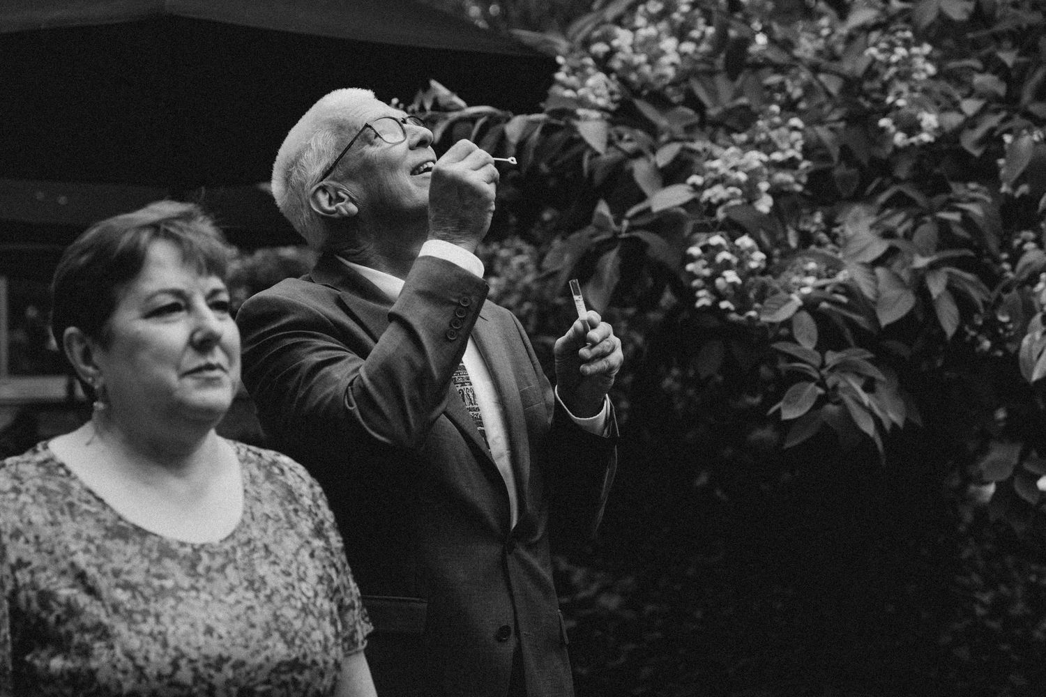 bride's parents playing with bible maker during ceremony at at Granite Brewery Toronto reception